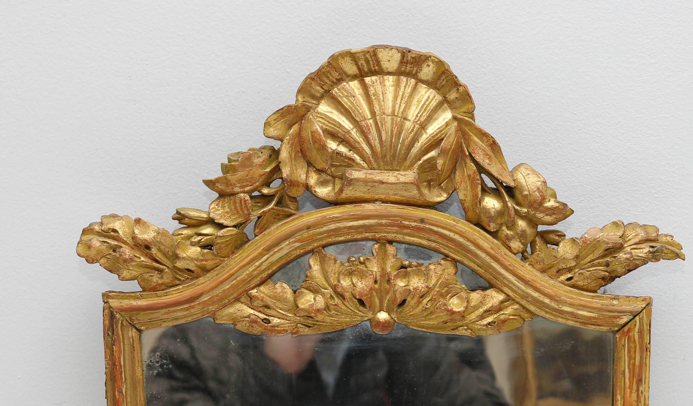 Italian 18th century carved and gilt neoclassical console mirror. Frame has been re-gilded. Original wavy mirror glass.