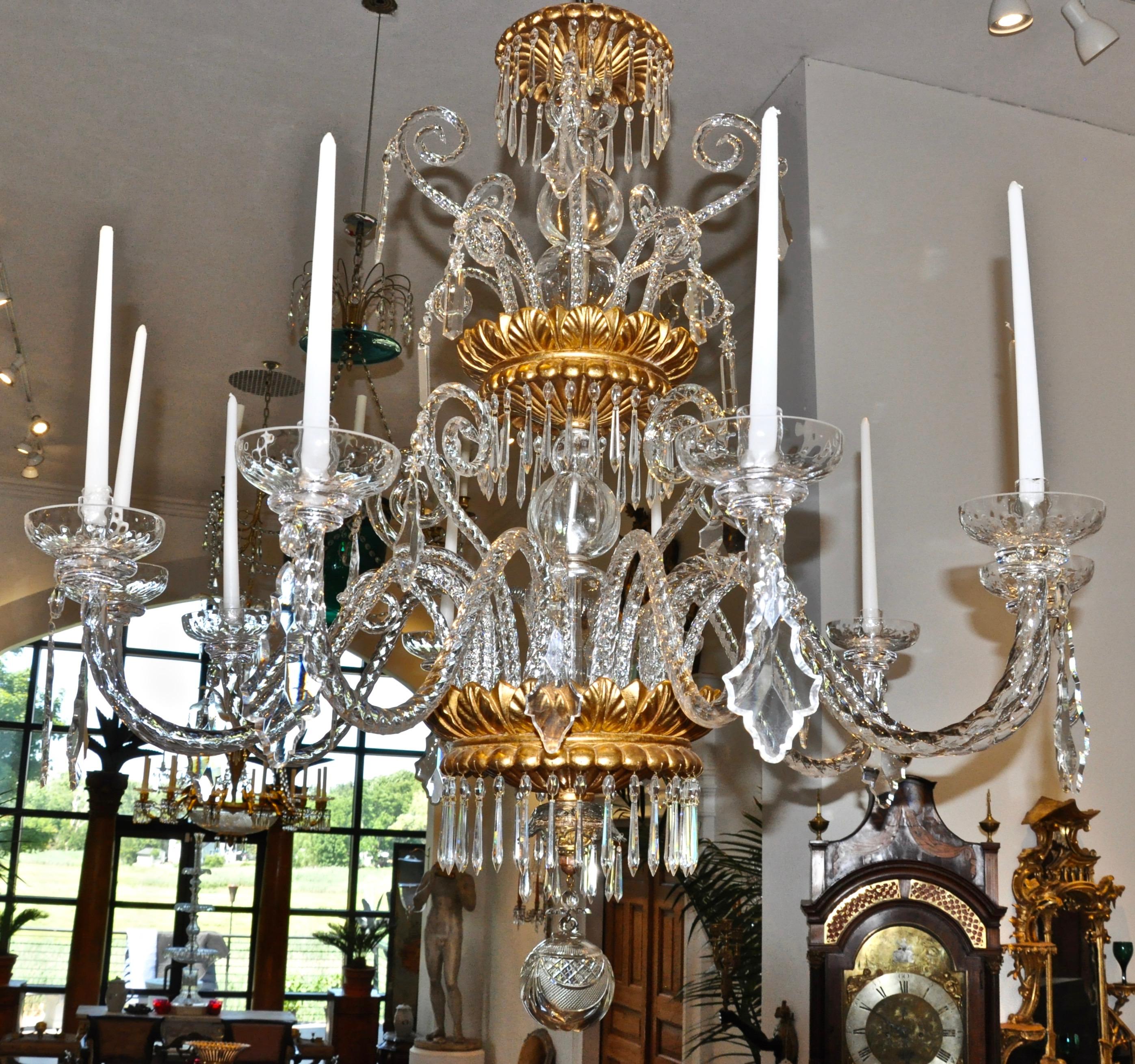 Midcentury Italian handblown neoclassical chandelier 

Italian chandelier of probable Murano origin. Ten lights issuing from foliate carved and gilt wooden bowls. Whimsical design. Stately yet engaging presence. Excellent condition. Now candles