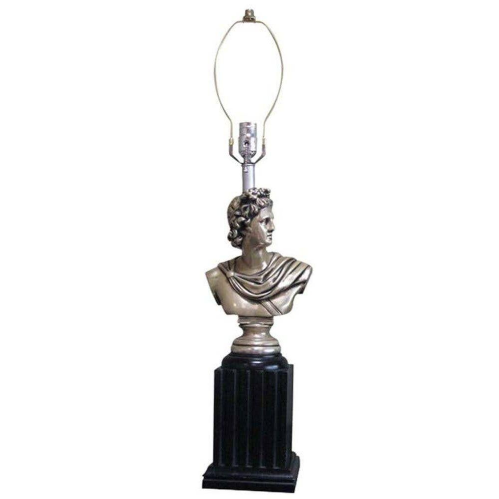 This pair of 1950s Neoclassical-style table lamps features the busts of Greek gods mounted on the lower half of a lacquered Doric column. The figures are skillfully carved in wood and finished with a rich brass-toned lacquer. The set includes one