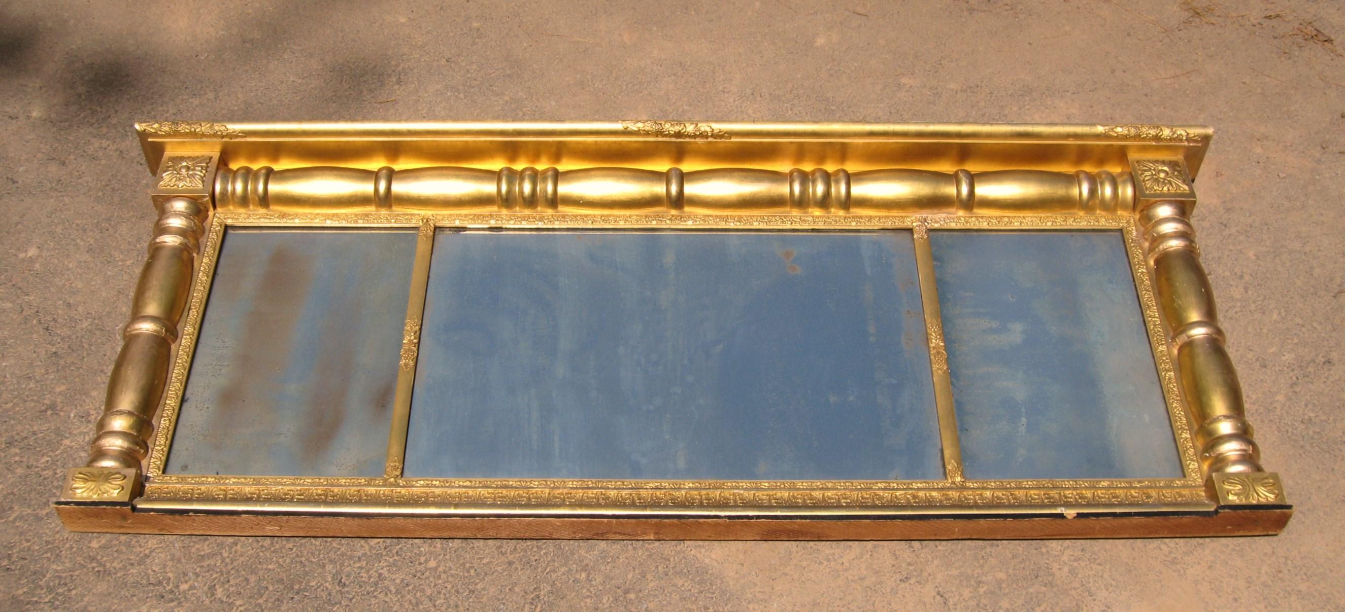 Wonderful three section neoclassical gold leaf gilt mirror, it retains the original mirror and gold gilt. Measuring 64.25 inches wide x 26 inches High x 4 inches deep, section sizes are 11 3/8 in x 17.5 in - 27 5/8 in x 17.5 in - 11 3/8 in x 17.5