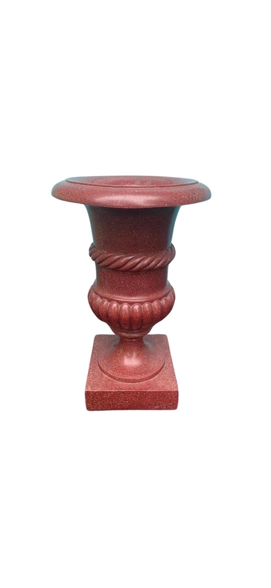 A vintage Grand Tour style Neoclassical Urn. The urn made of a Faux porphyry marble with carved surface and an open top for floral arrangements.