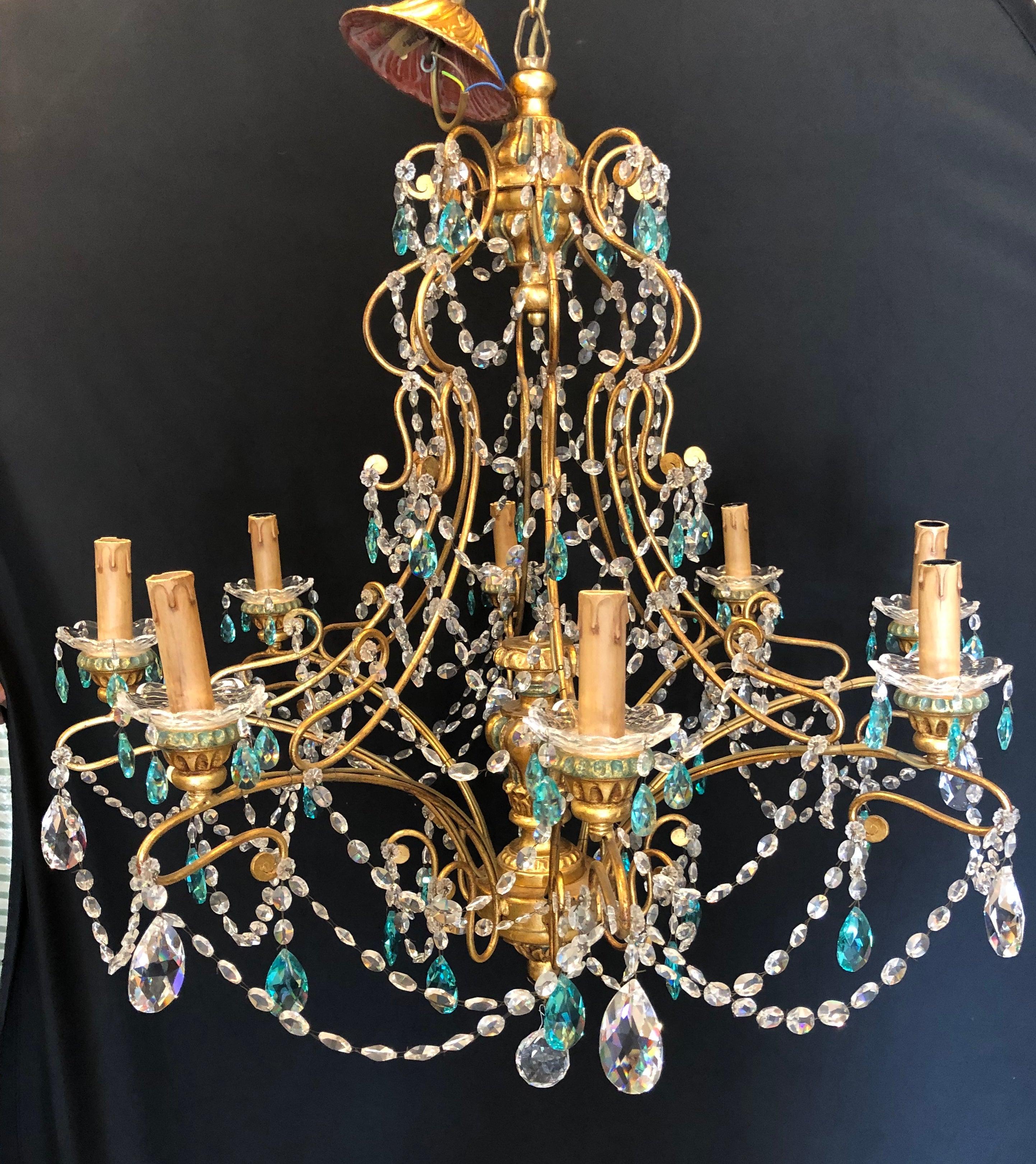 Neoclassical handcrafted Italian gilt metal and crystal chandelier. Having a pair of matching wall sconce sold separately this sleek and stylish Murano crystal chandelier is reminiscent of the workmanship that has made Alba lighting a household name