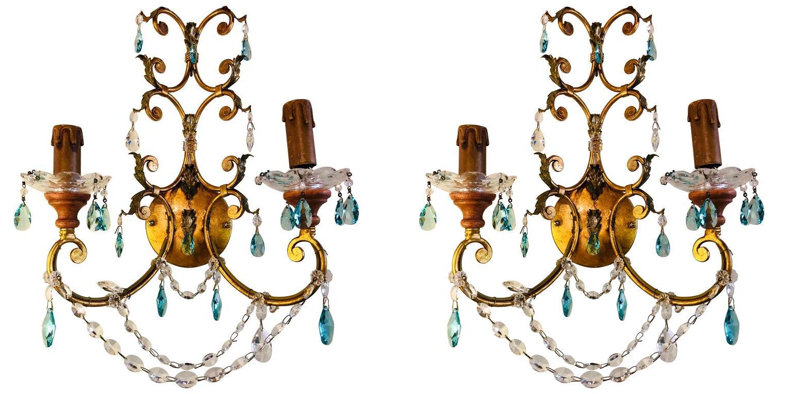 A pair of neoclassical handcrafted Italian gilt metal and crystal sconces neoclassical handcrafted Italian gilt metal and crystal wall sconces having a matching chandelier sold separately. This sleek and stylish Murano crystal pair of sconce is
