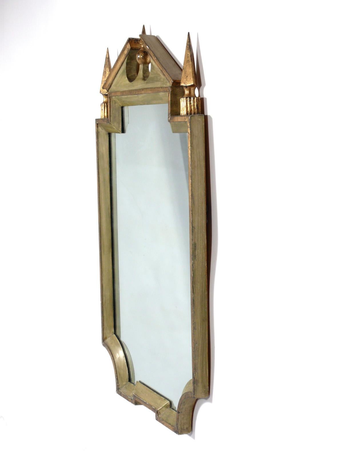 Neoclassical Italian mirror, made by Palladio, Italy, circa 1950s. It is a pale green color with gold gilt accents. Original mirror and frame retain warm original patina.