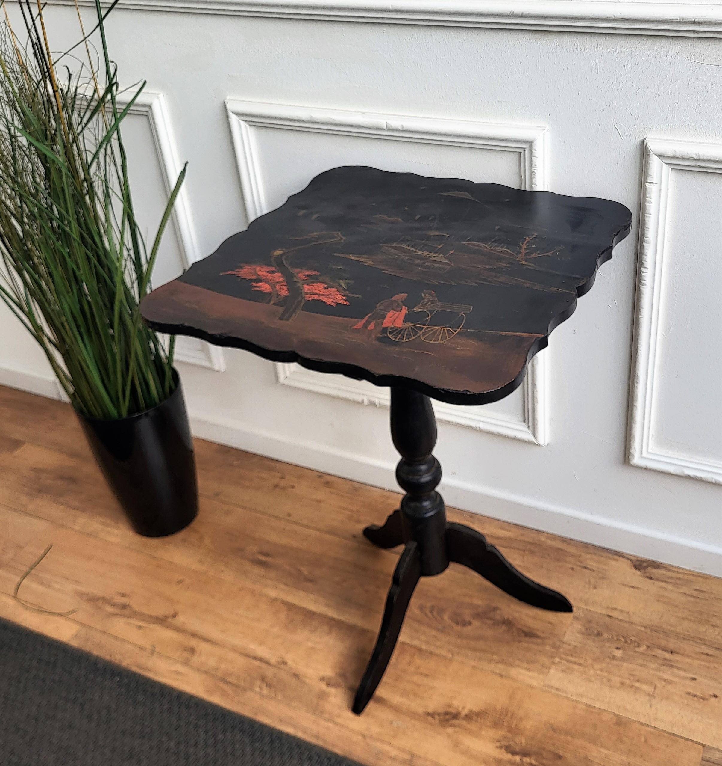 A beautiful Italian Walnut side table with great details and painted top with carved shaped frame side and tripod feet legs. The beautiful top painted decors are classic figures in chinoiserie style. A very special, elegant, modern and classic piece