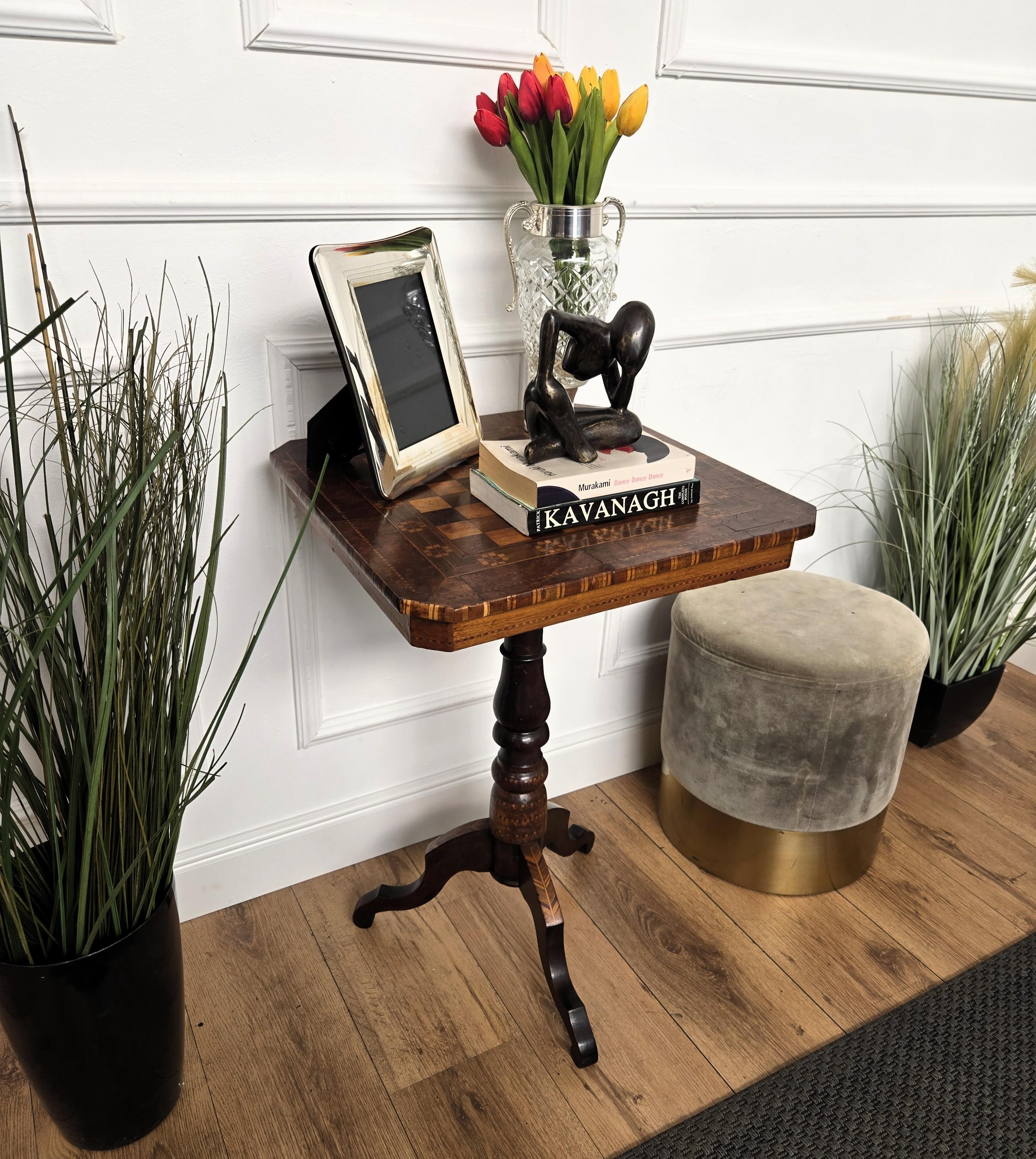 A beautiful Italian walnut side table with great details and frames shaped in Victorian, Napoleon III, Louis XV style with chessboard on the top and the tripod feet legs. A very elegant, modern and classic piece that showcases the refined