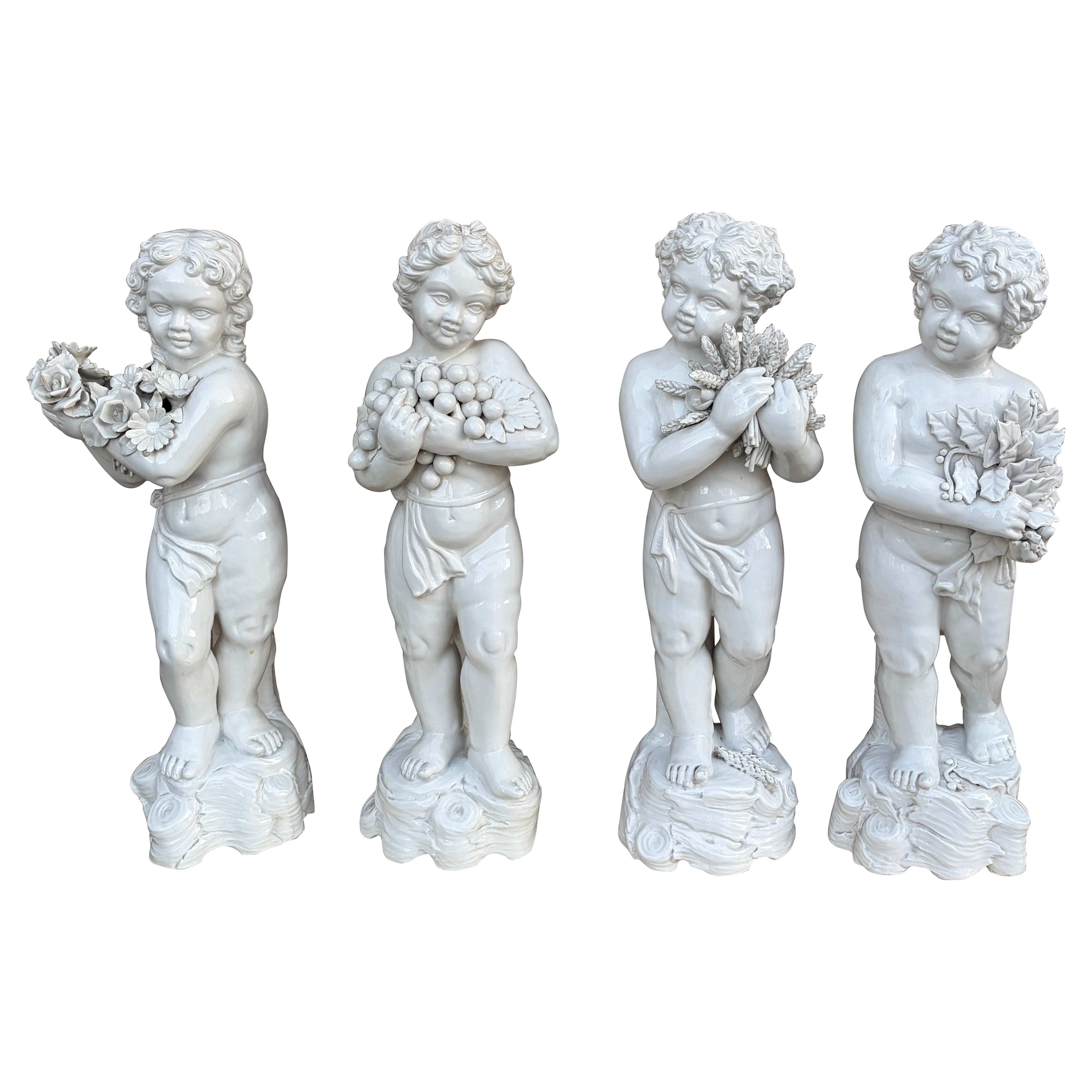 Neoclassical Italian White Porcelain Allegorical Cherub Putti Statues, Set of 4 en vente