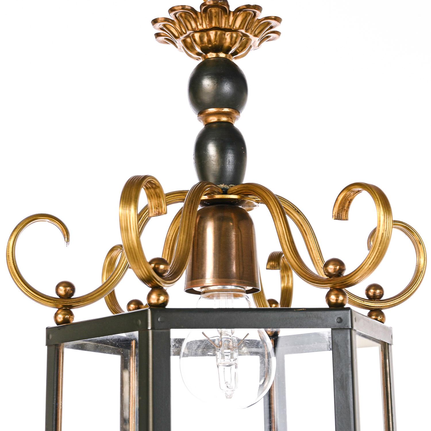 A unique lantern, consisting of six glass panels etched with a star prism. Brass and wooden dark green frame.