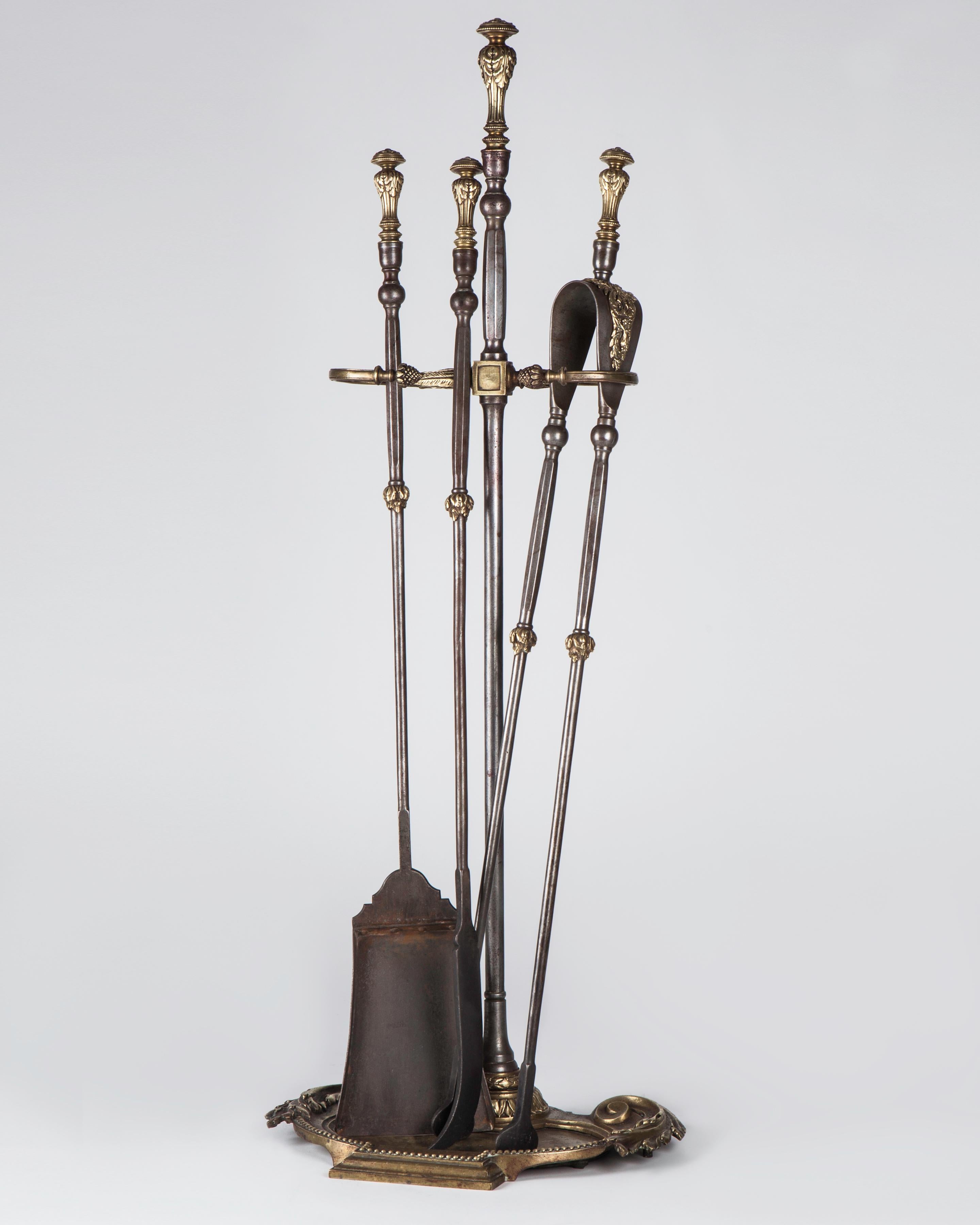 AFP0639

circa 1880
A set of antique fireplace tools and coordinating stand having finely chased cast brass details. In their original aged polished brass and steel finish.

Dimensions:
Overall: 34-5/8