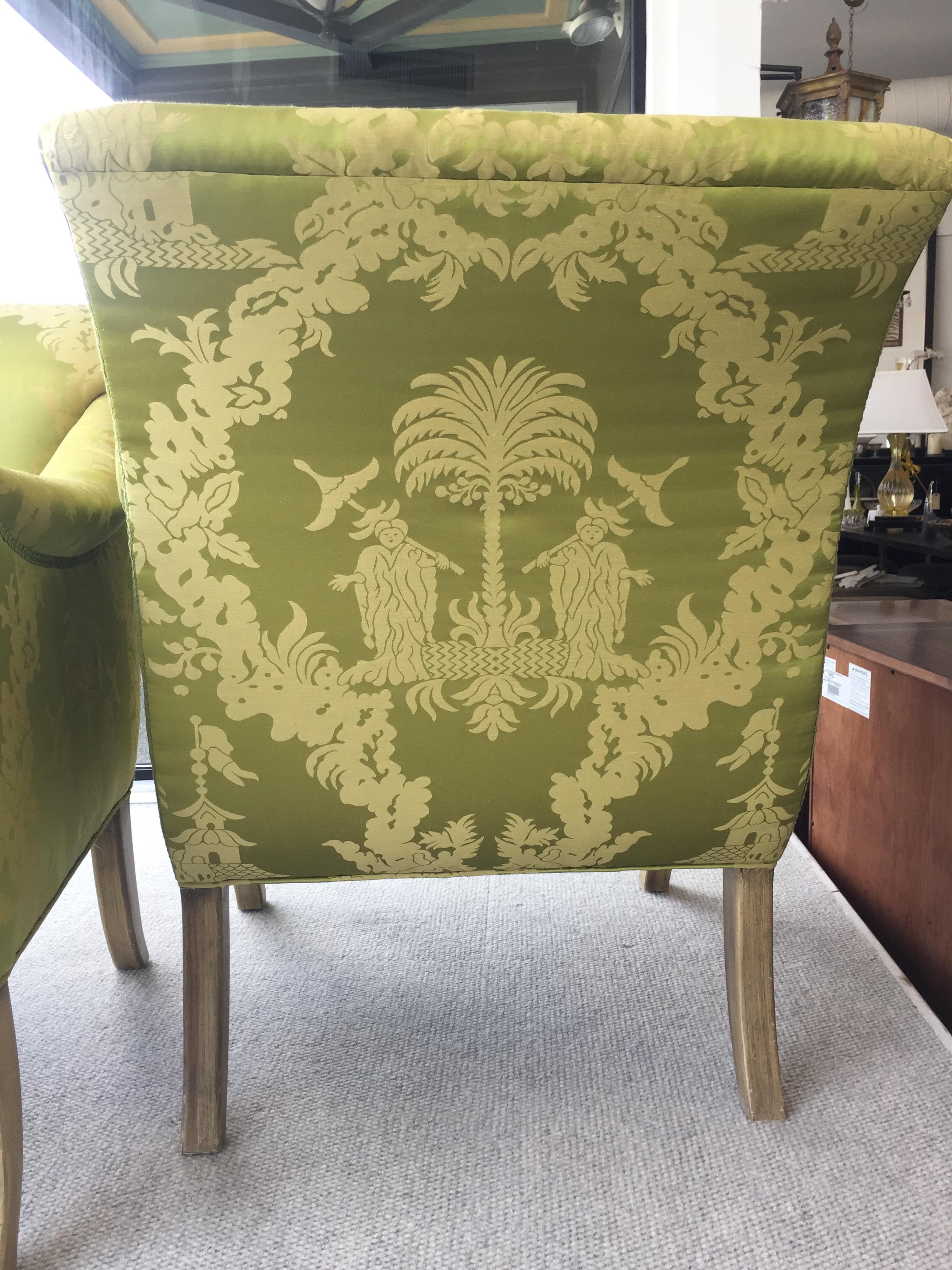 These gorgeous and generously proportioned lounge chairs created for William Eubanks of New York are upholstered in a lovely chartreuse silk with a chinoiserie pattern. The legs have a subtle faux coloration. These chairs are done full goose down.