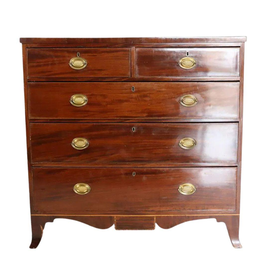 A refined George III style mahogany chest of drawers featuring a balanced, neoclassical design. The chest is arranged in four graduated tiers, with the top tier divided into two side-by-side drawers, totaling five drawers overall. Each drawer is
