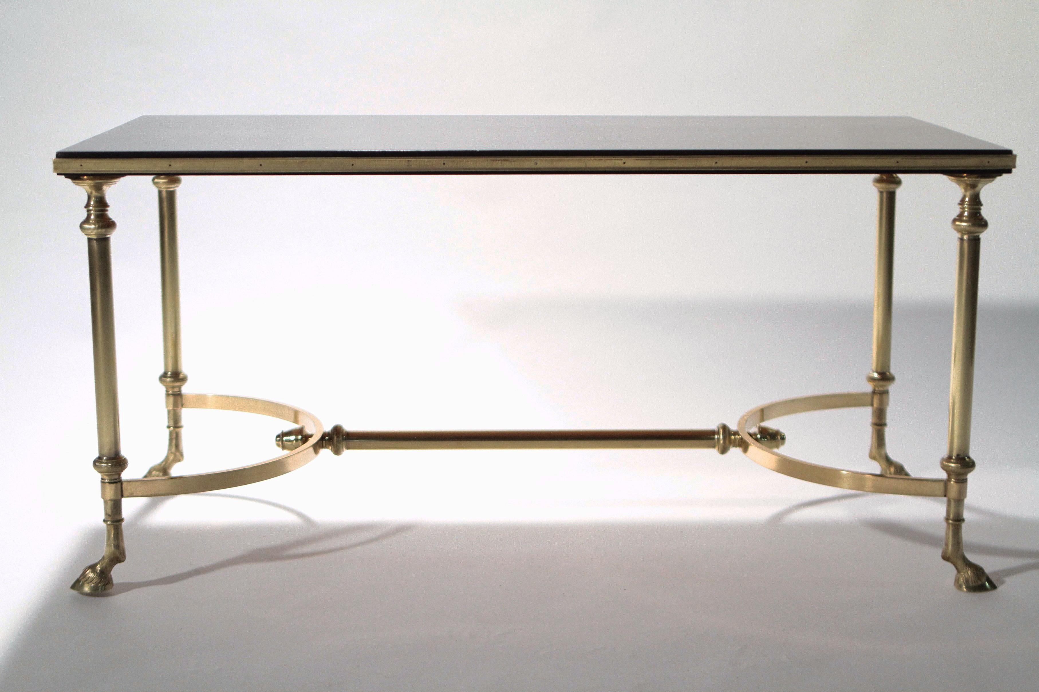 This piece surprises with each closer look. An imaginative coffee table with brilliant brass feet and a black lacquer surface, the beautiful details are what makes the table distinct, from well-crafted brass hoof feet, to the aesthetically pleasing