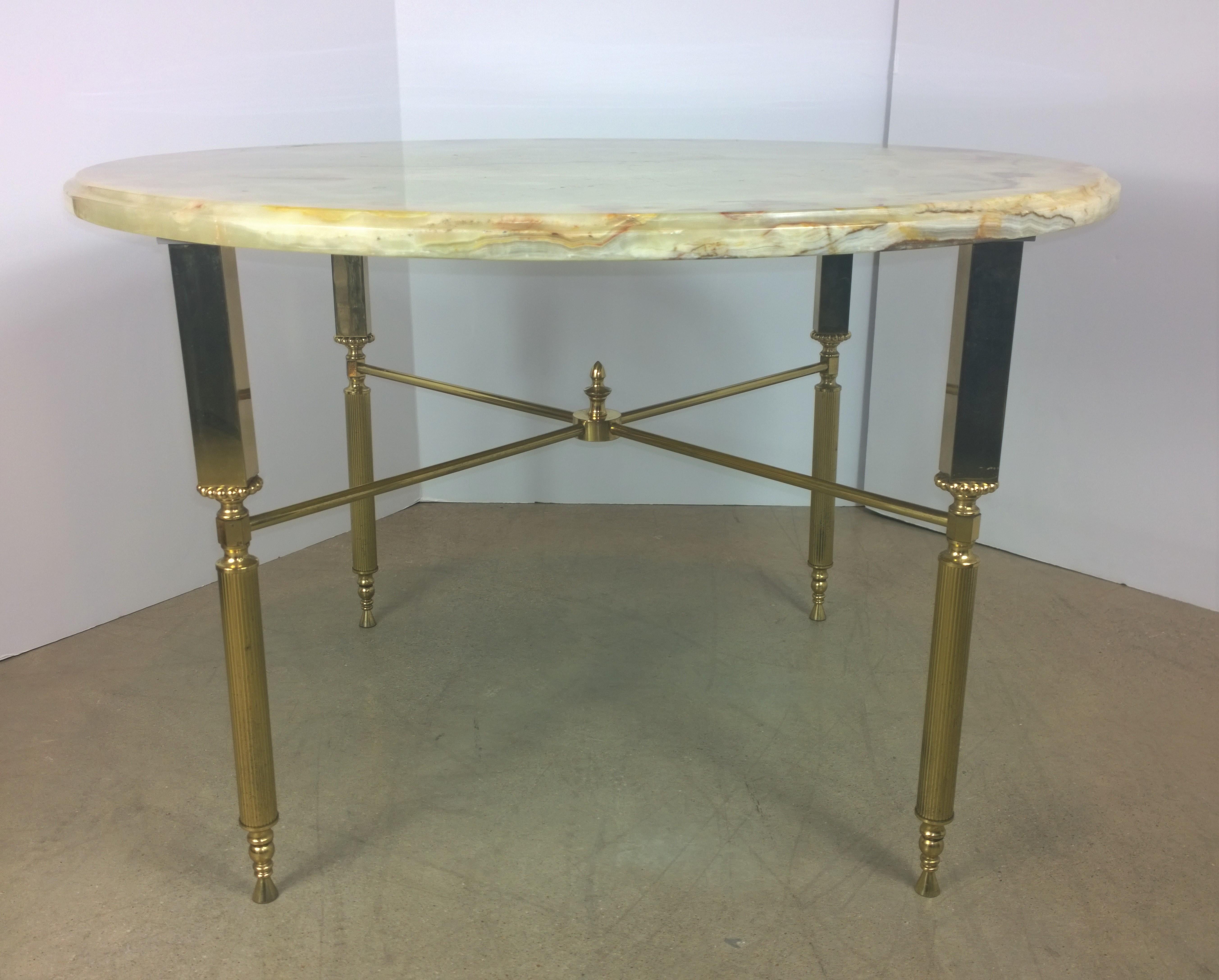 Offered is a midcentury neoclassical gorgeous yellow, orange and red onyx with a brass frame side or small cocktail/coffee table attributed to the Buenos Aires workshops of Maison Jansen. Exuding restrained elegance, this piece would look fabulous