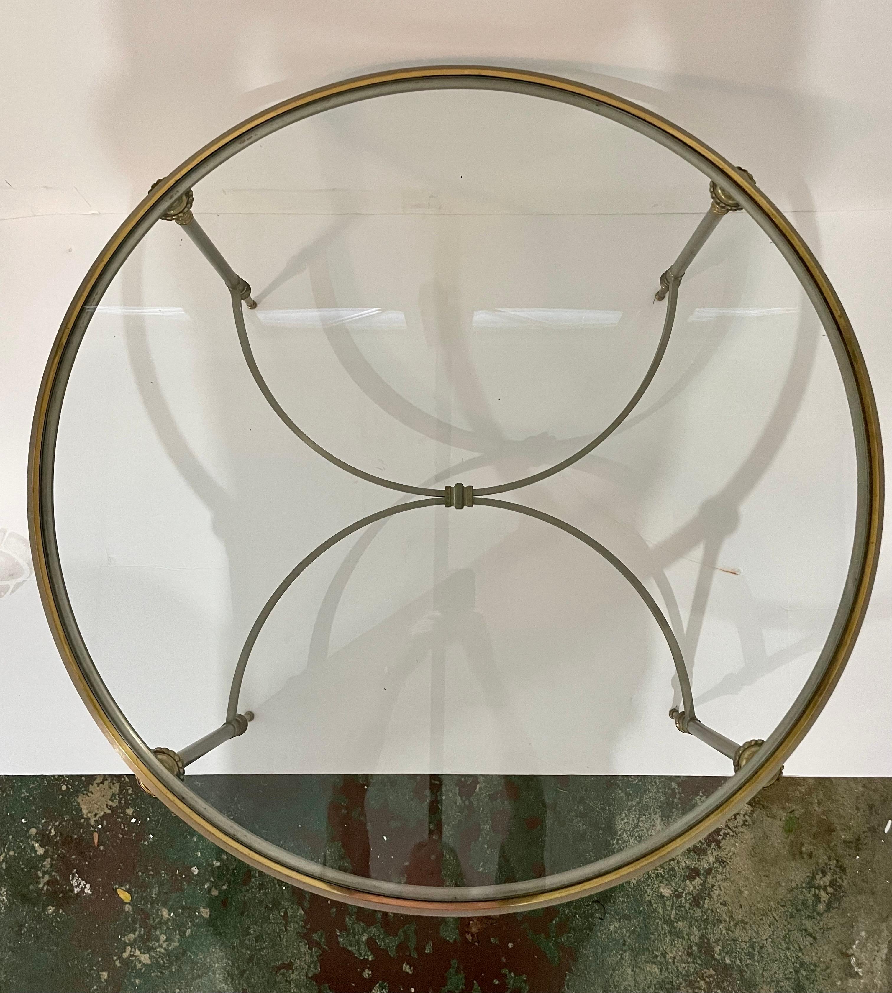 Neoclassical Revival, Maison Jansen style brushed steel and brass coffee table with inset glass top. Designed by Yale Burge. Circa 1960s. Please note of wear consistent with age including minor oxidation on the metal trim and minor scratches on the