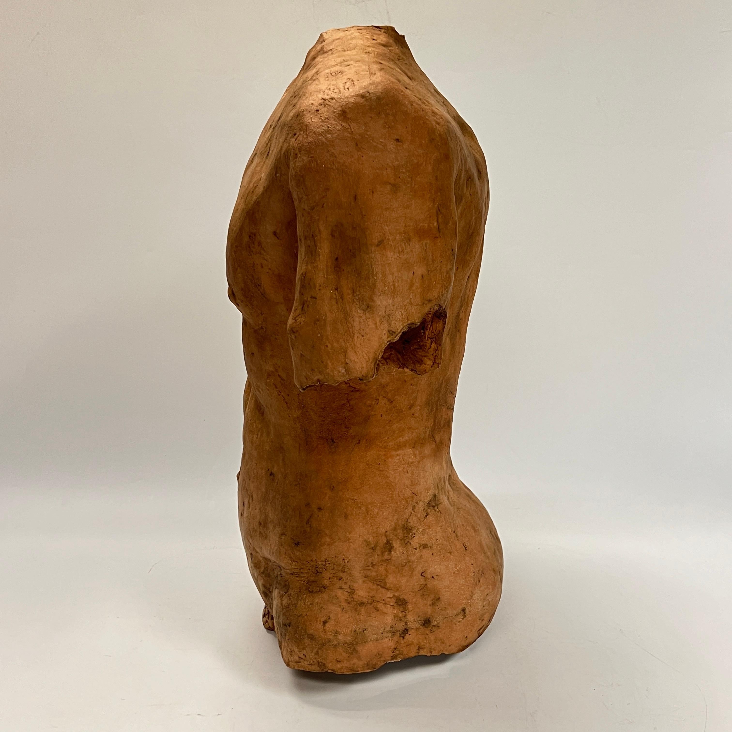 Vintage sculpture in terracotta depicting a male torso in the Grand Tour style after the ancient Roman or Greek.  19 1/2 inches tall.  Unsigned and dating from the mid-century period.