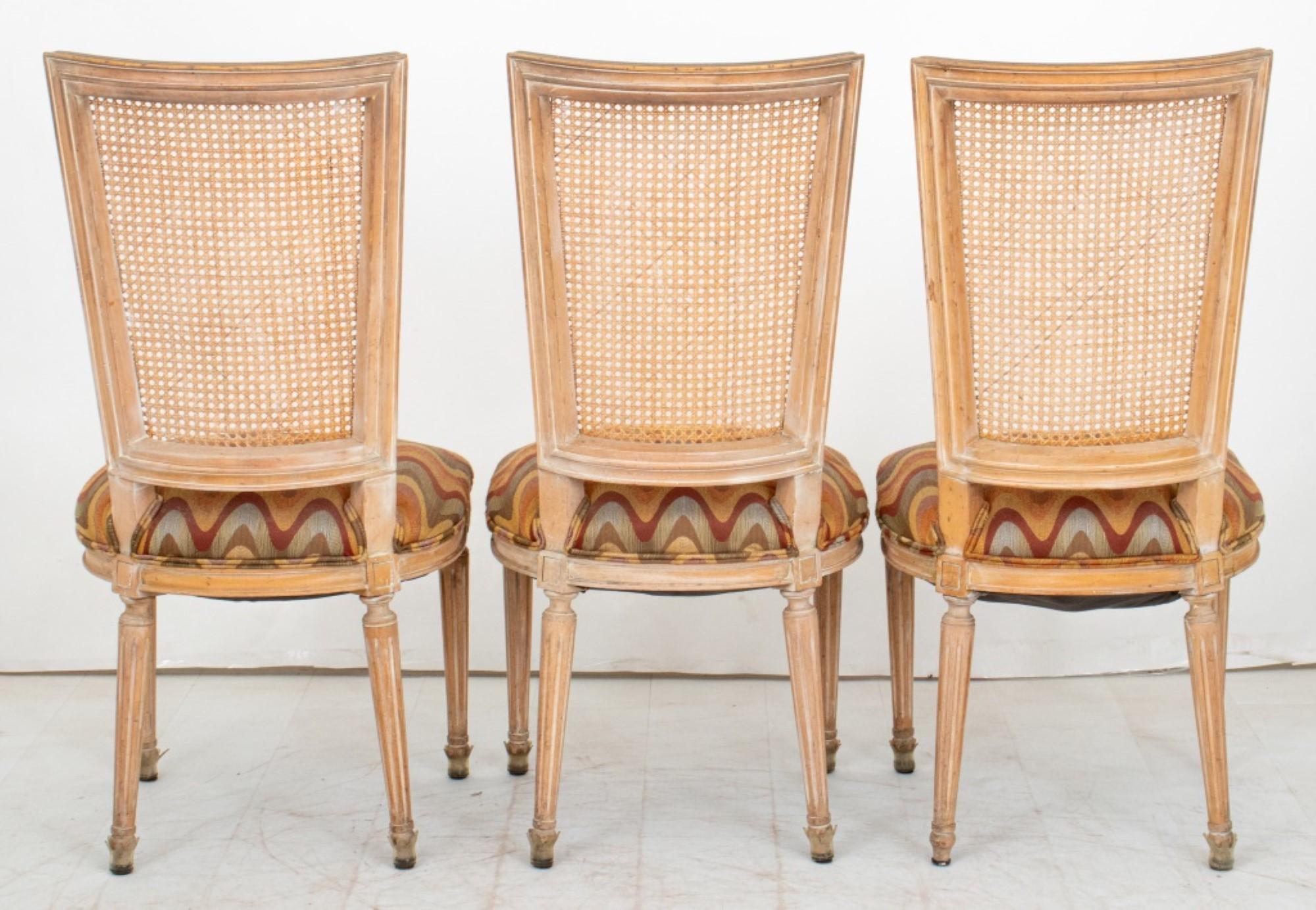 Set of Italian Neoclassical Style Chairs

Composition: Three hardwood and cane back dining or side chairs upholstered with polychrome wave motif textile, and two upholstered armchairs.

Dealer: S138XX