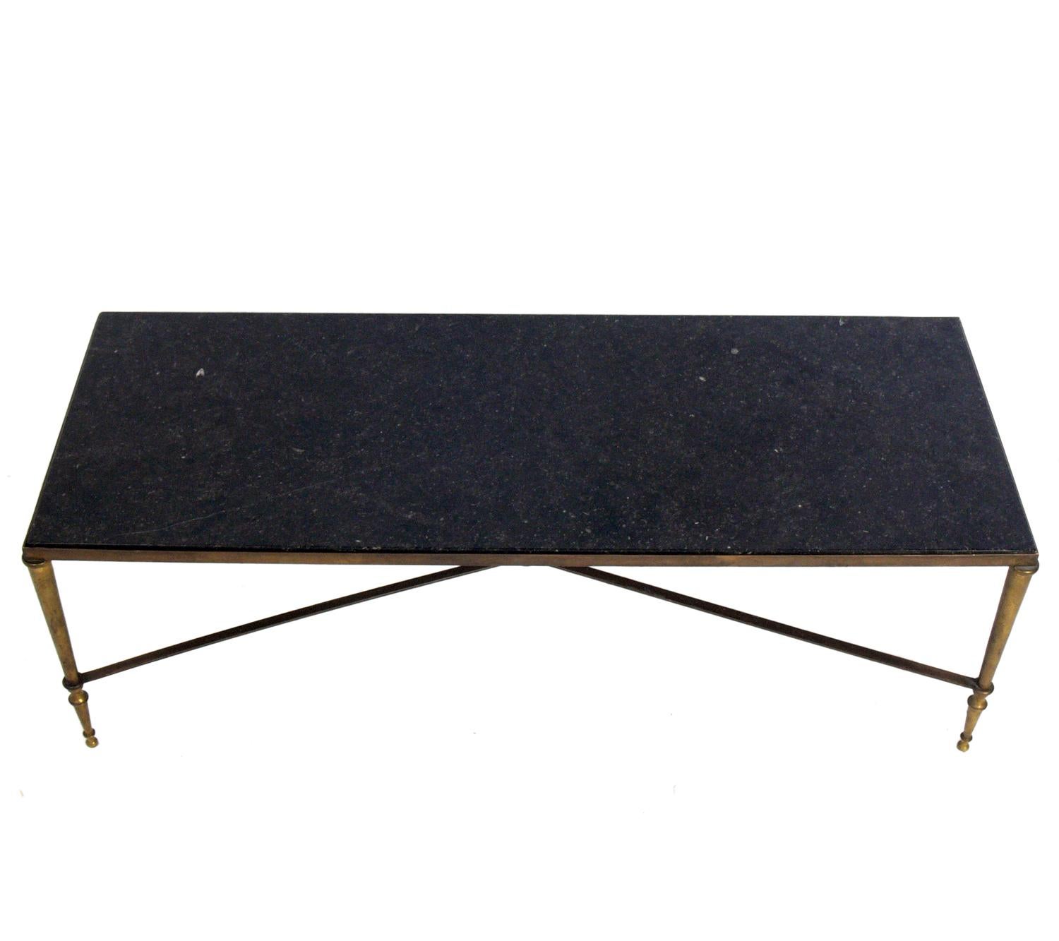 Neoclassical marble and brass coffee table, probably French, circa 1940s. Retains warm original patina to the brass frame.