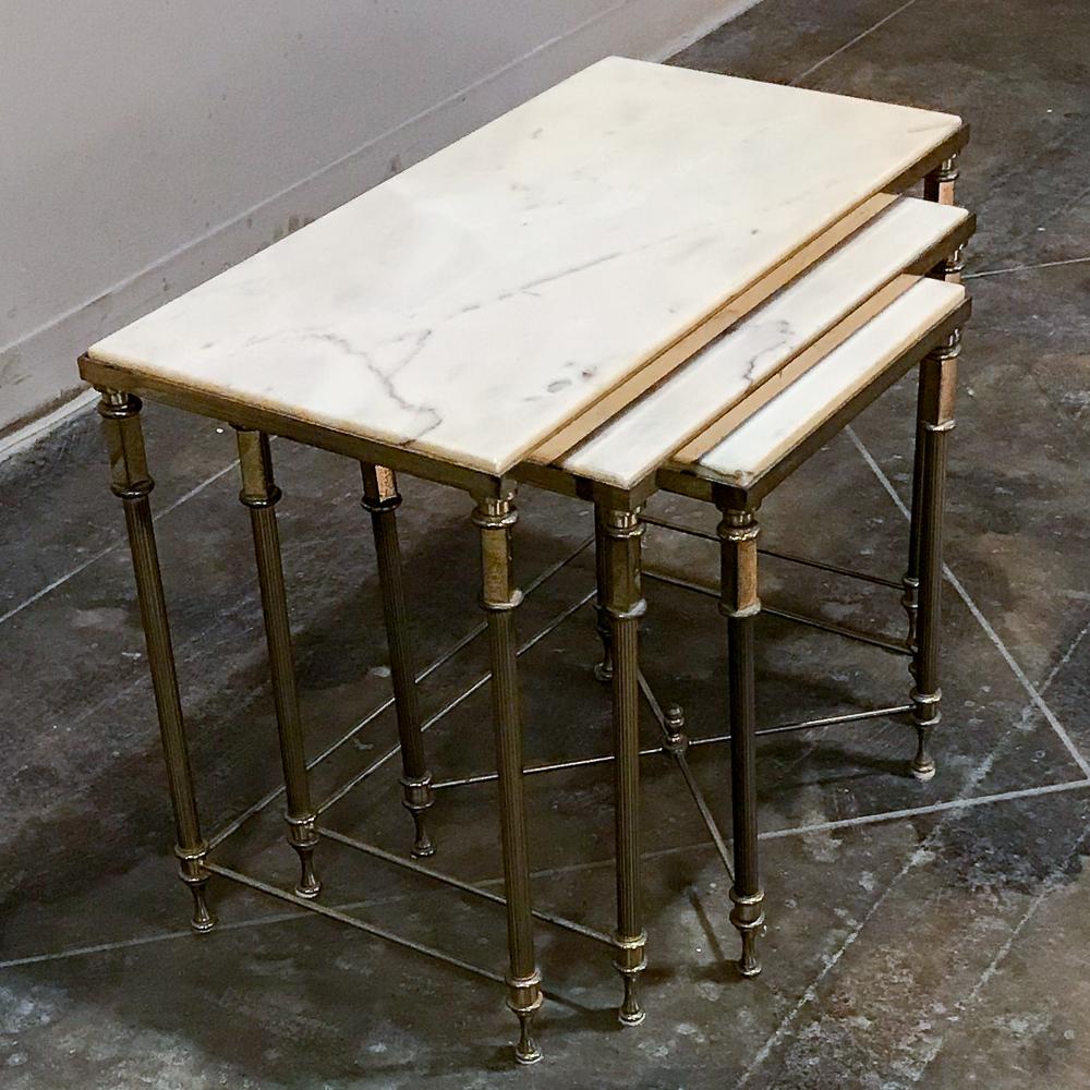 Neoclassical marble and brass nesting tables, in the style of Maison Jansen are ideal for entertaining, with the ability to provide a single, double or triple marble top end table surface in an instant! Classical styling ensures their compatibility