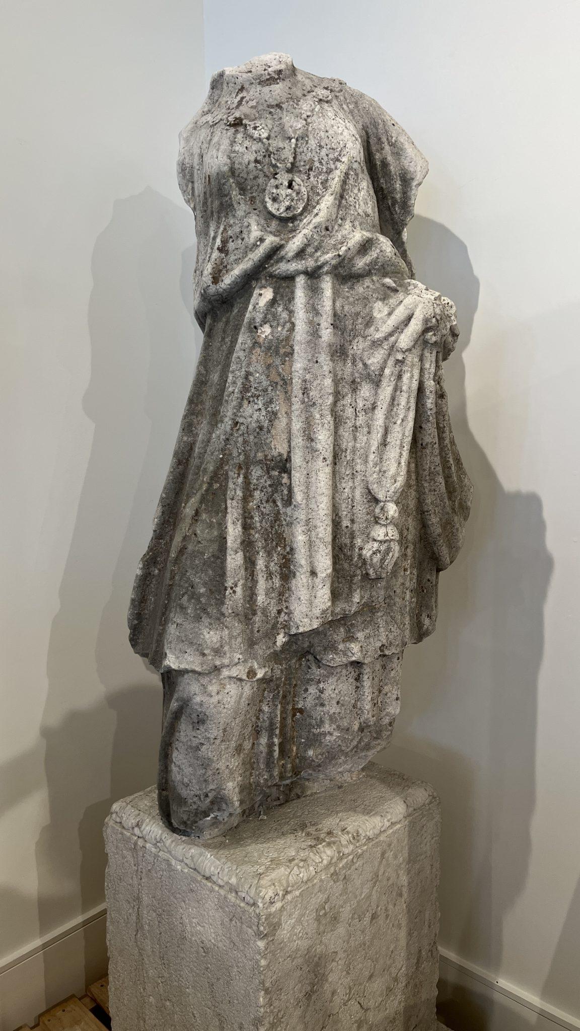 Romanesque sculpture is bold, dignified and gets our attention. This Neo-classic form is all that and more. This is a large female figure with a gentle S curve. Her tunic has beautiful draping and her left hand rests on a knot. The knot often