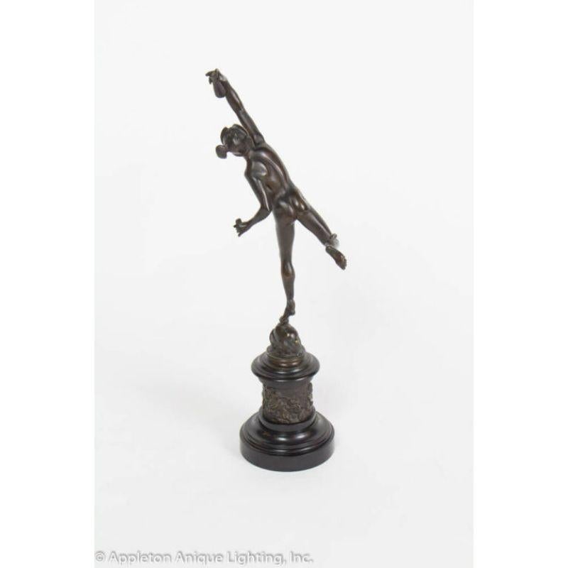 Statue of Mercury. Cast in bronze. Beautiful casting with Mercury in a dynamic pose, holding a vial. He is leaping off of a face that represents the winds, symbolizing his quickness. The base is surrounded by cherubs. This statue is a copy after a