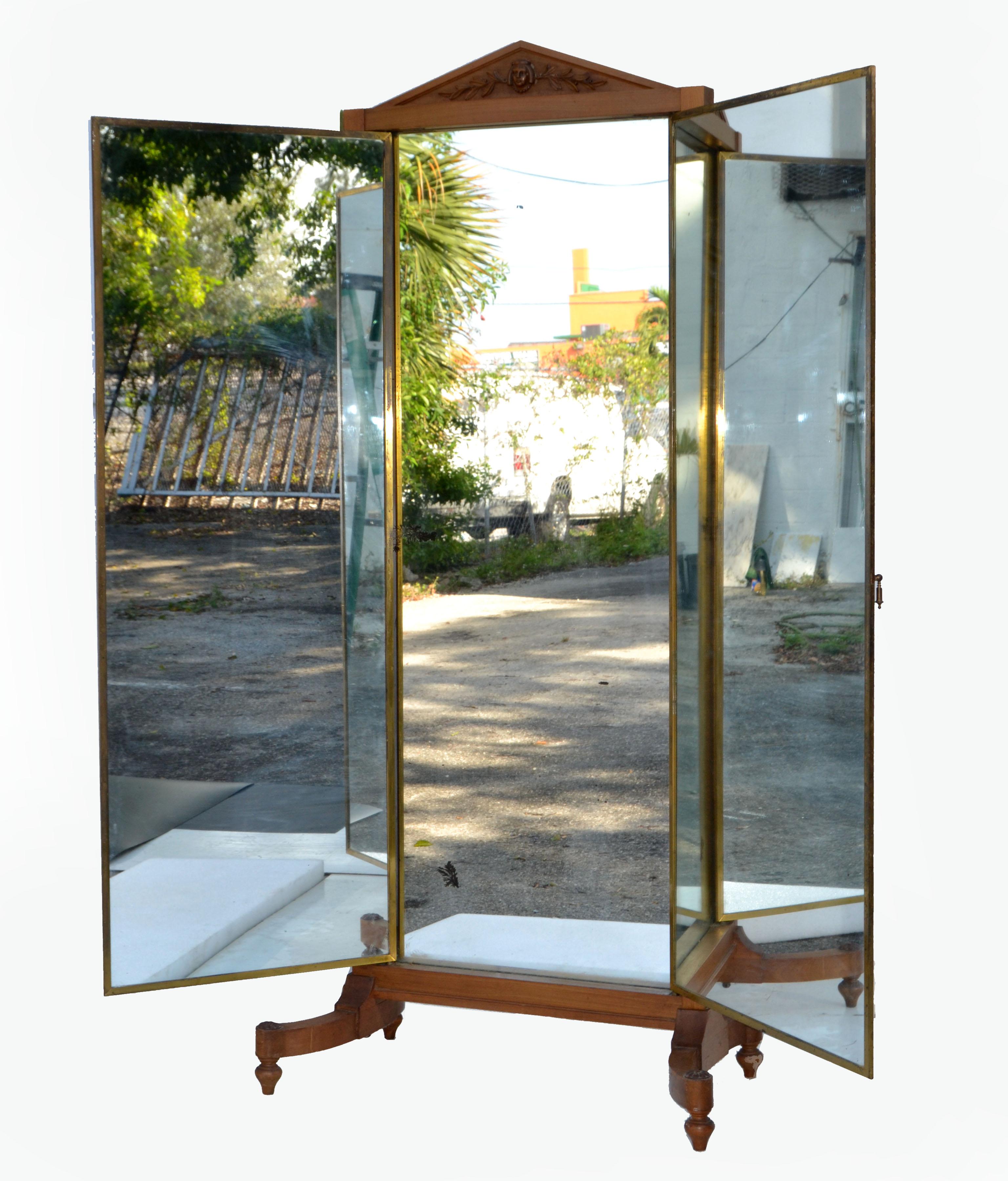 Art Nouveau hand carved walnut 3 panel store mirror by Miroir Brot from Paris, France.
Beautifully crafted in Walnut Wood and decorated with brass hardware.
The 3 parts can be opened individual.
Measurement open: 23.5 Depth x 50.5 inches width.
