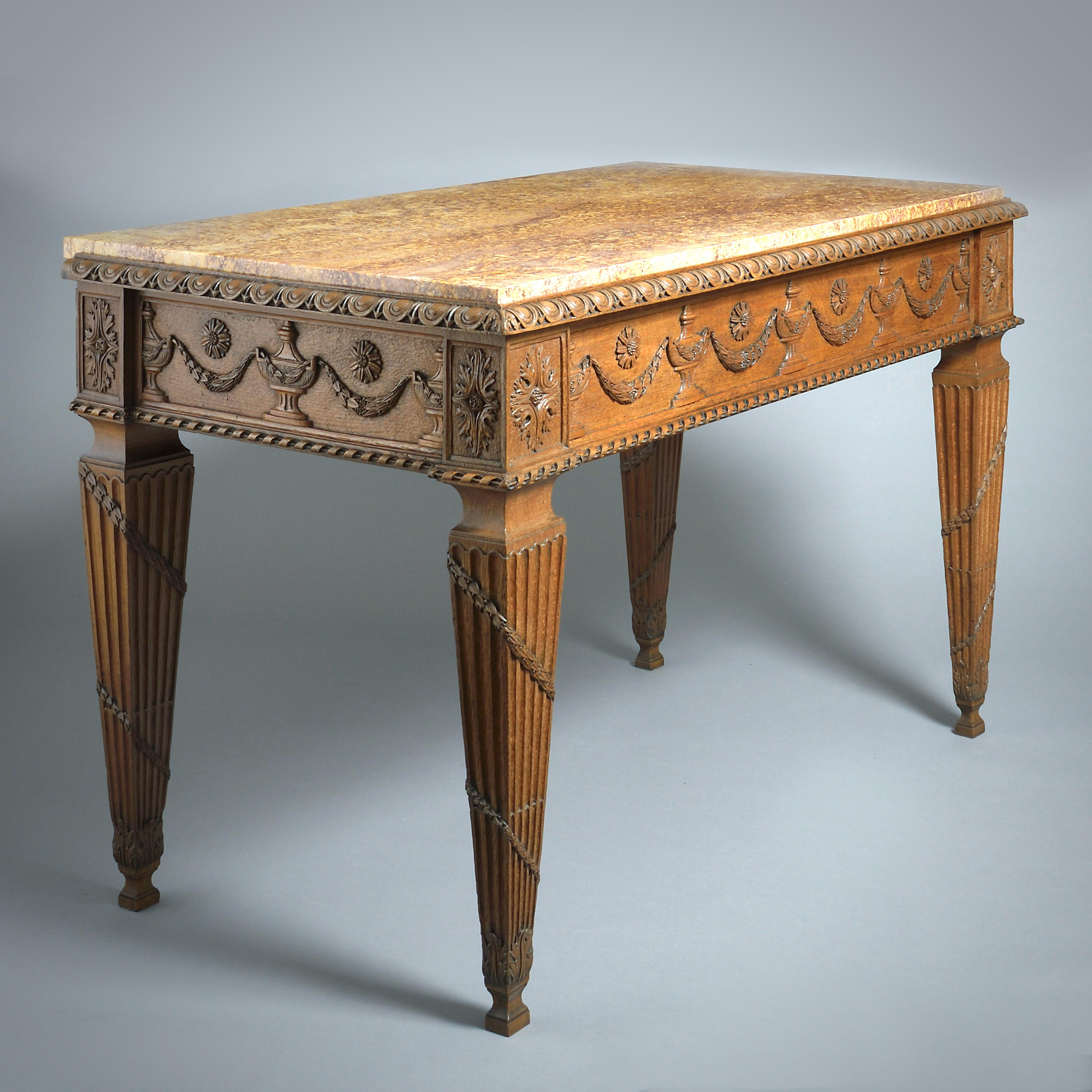 A FINE NEOCLASSICAL OAK SIDE TABLE, LOW COUNTRIES OR ALSACE, CIRCA 1790.

With brocatelle marble top. The frieze fitted with a long drawer.