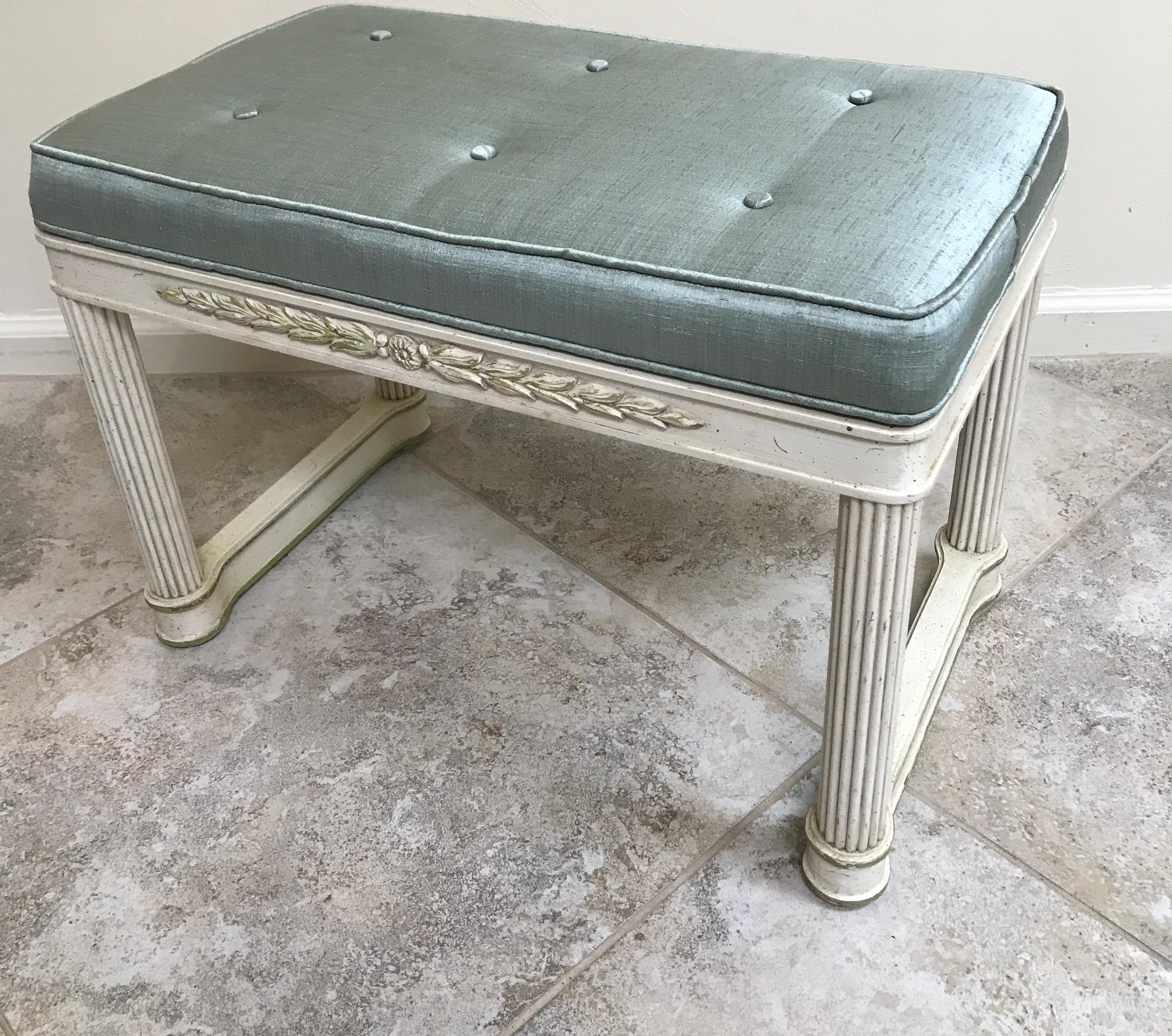 Carved and painted neoclassical bench by Palladio. Silk cushion top.
