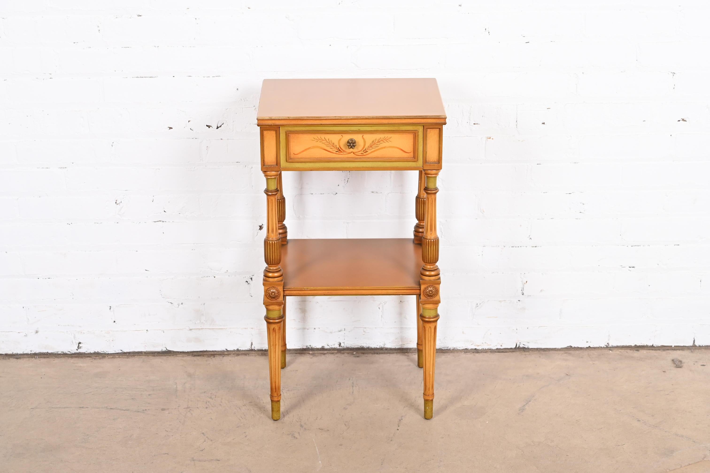 A gorgeous Neoclassical or Louis XVI style nightstand

In the manner of Grosfeld House

USA, Circa 1920s

Carved mahogany, with painted and gilt details.

Measures: 15