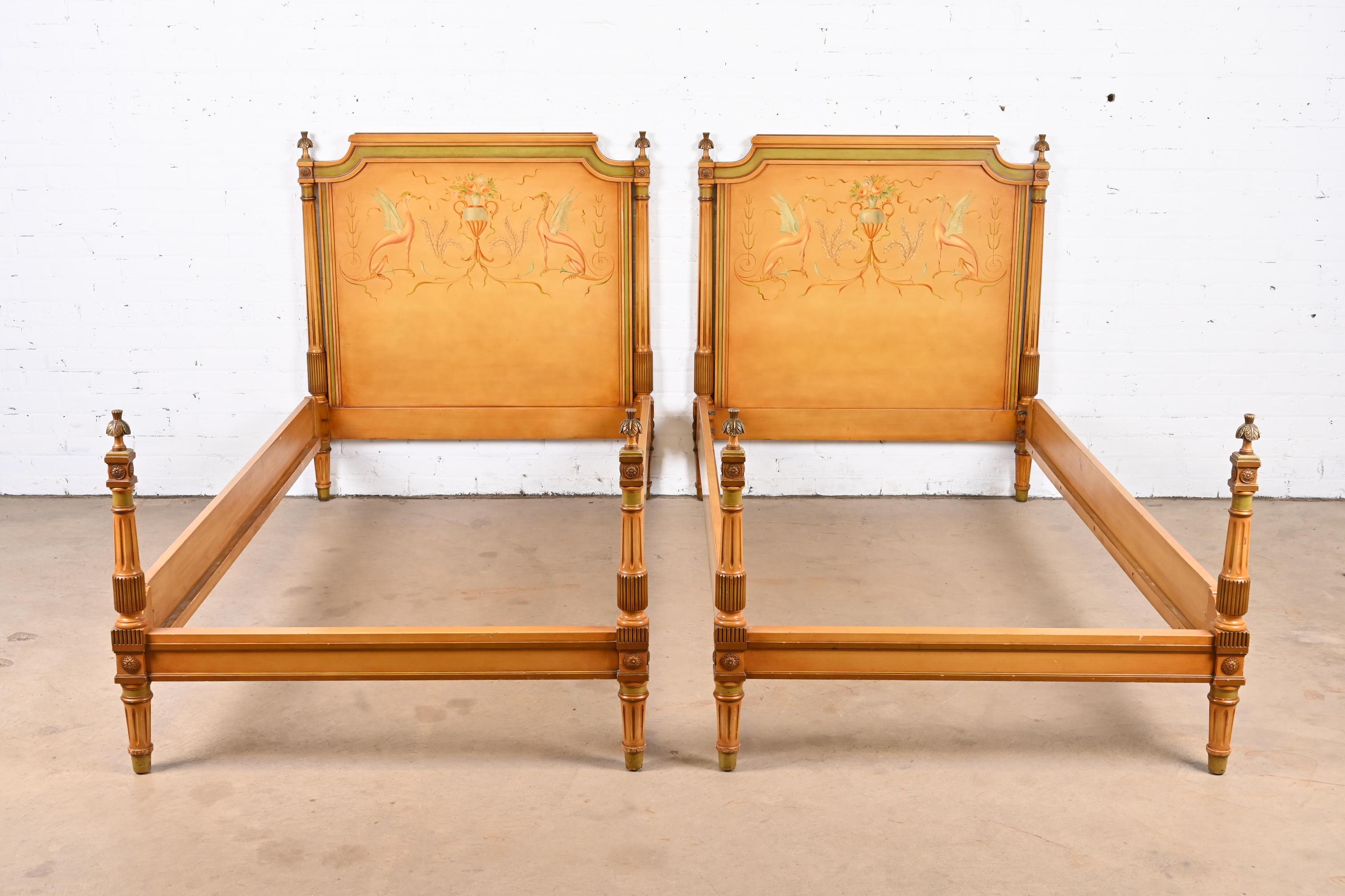 A gorgeous pair of Neoclassical or Louis XVI style twin beds

In the manner of Grosfeld House

USA, Circa 1920s

Carved mahogany frames, with painted and gilt details.

Measures: 42