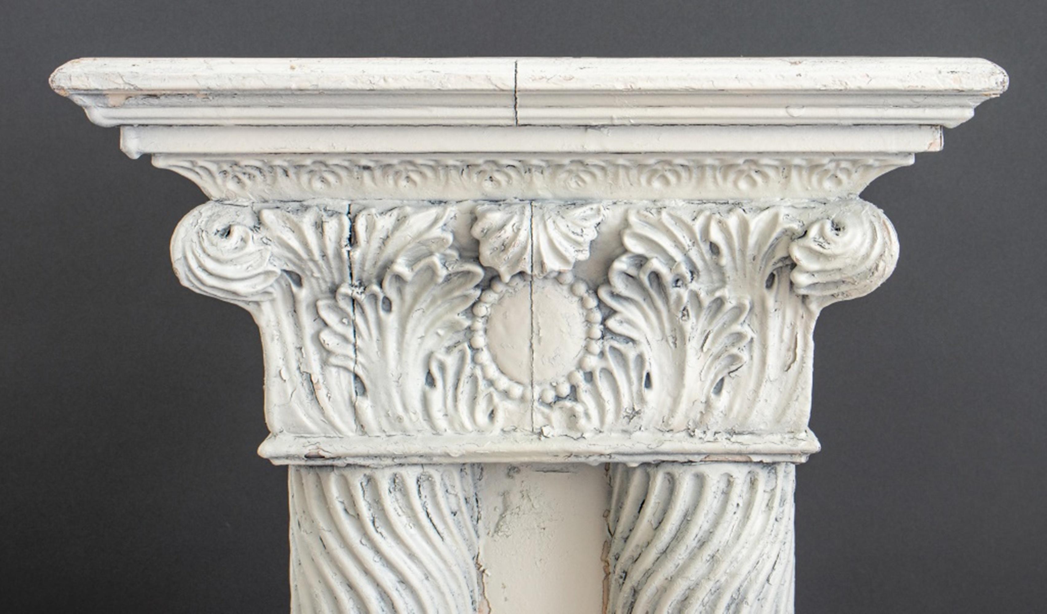 Neoclassical style white painted wood pedestal or plant stand with a Corinthian capital above four carved columns above a square base, circa early twentieth century.

Dimensions: 28