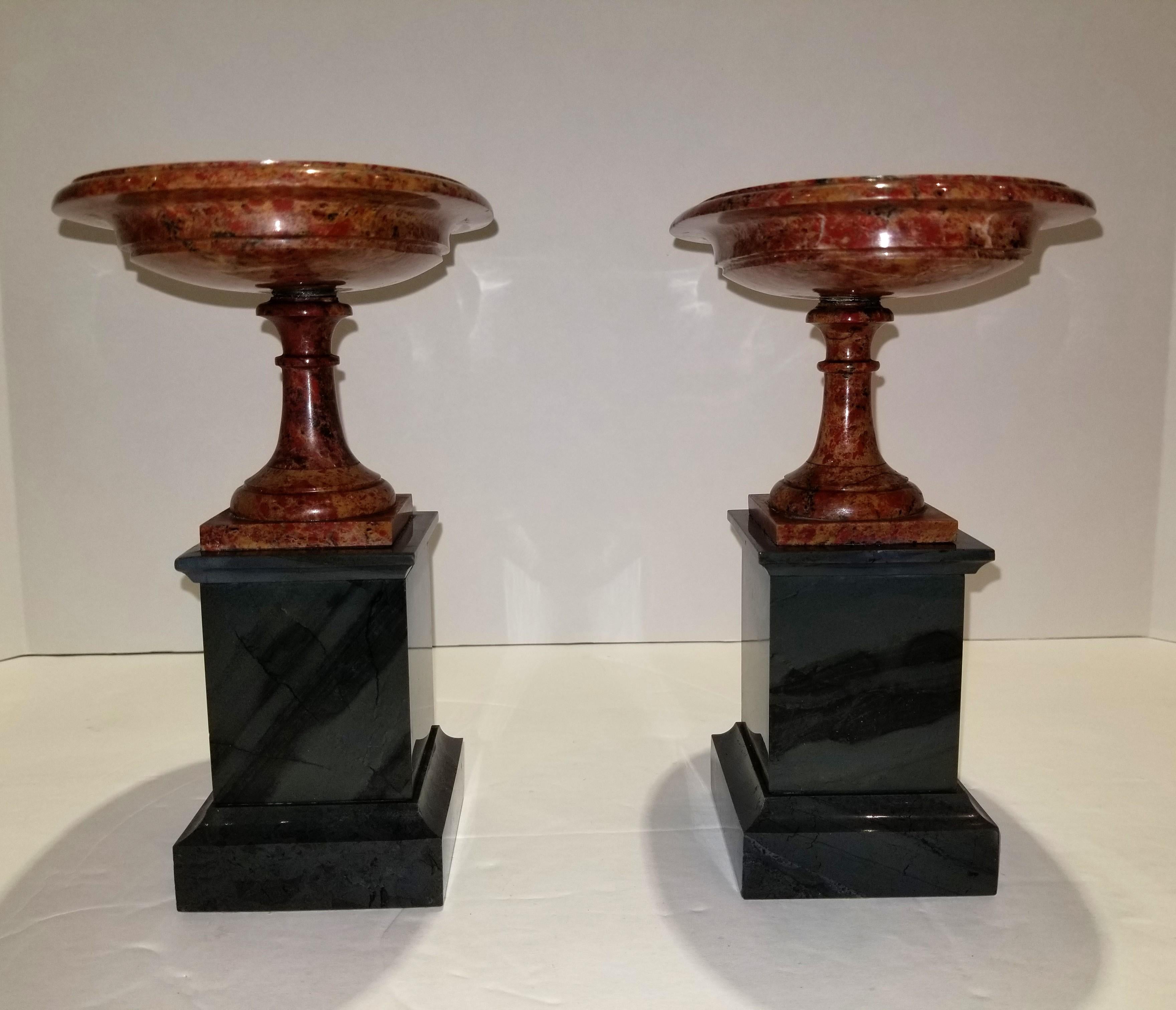 Remarkable pair of Russian neoclassical period red jasper and Russian Kalgar jasper oval shaped tazzas. These beautiful hand-carved oval shaped Russian red jasper tazzas are seated on two beautiful hand-carved and hand polished kalgar jasper column