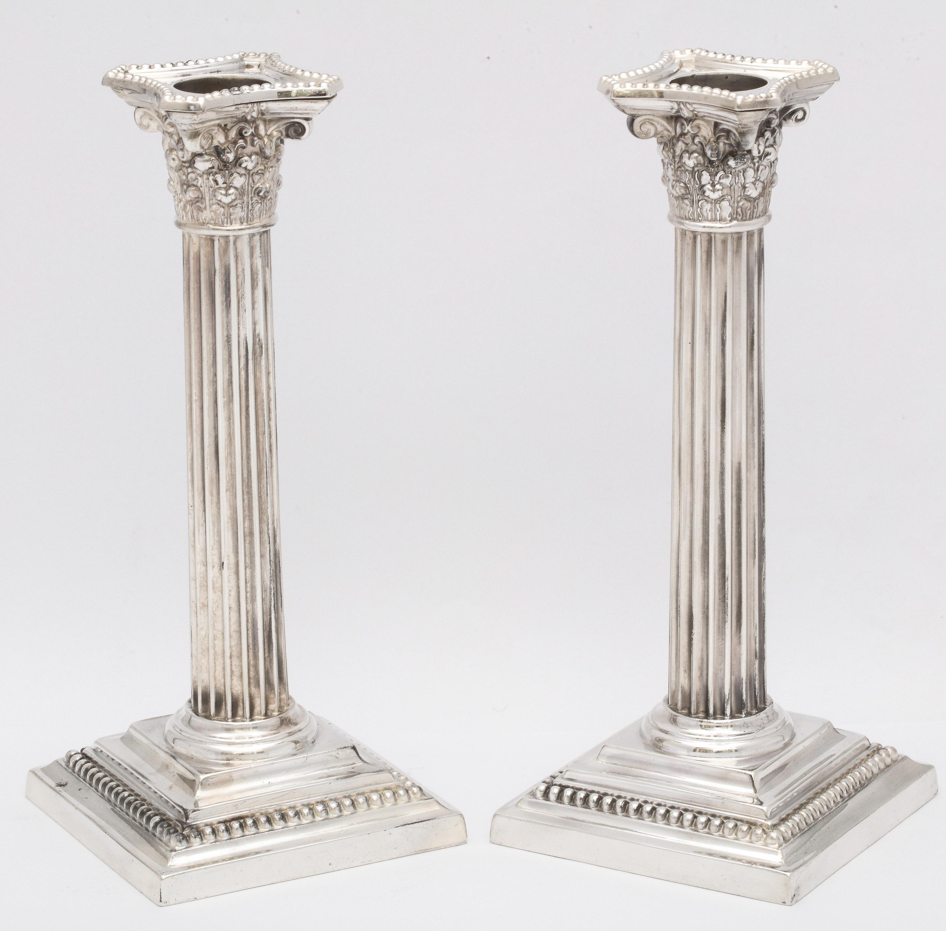 Neoclassical pair of sterling silver Corinthian column candlesticks, Gorham Manufacturing Company, Providence, Rhode Island, circa 1900. Each candlesticks measures 7 3/4 inches high x 3 1/4 inches deep (across base) x 3 1/4 inches wide (across