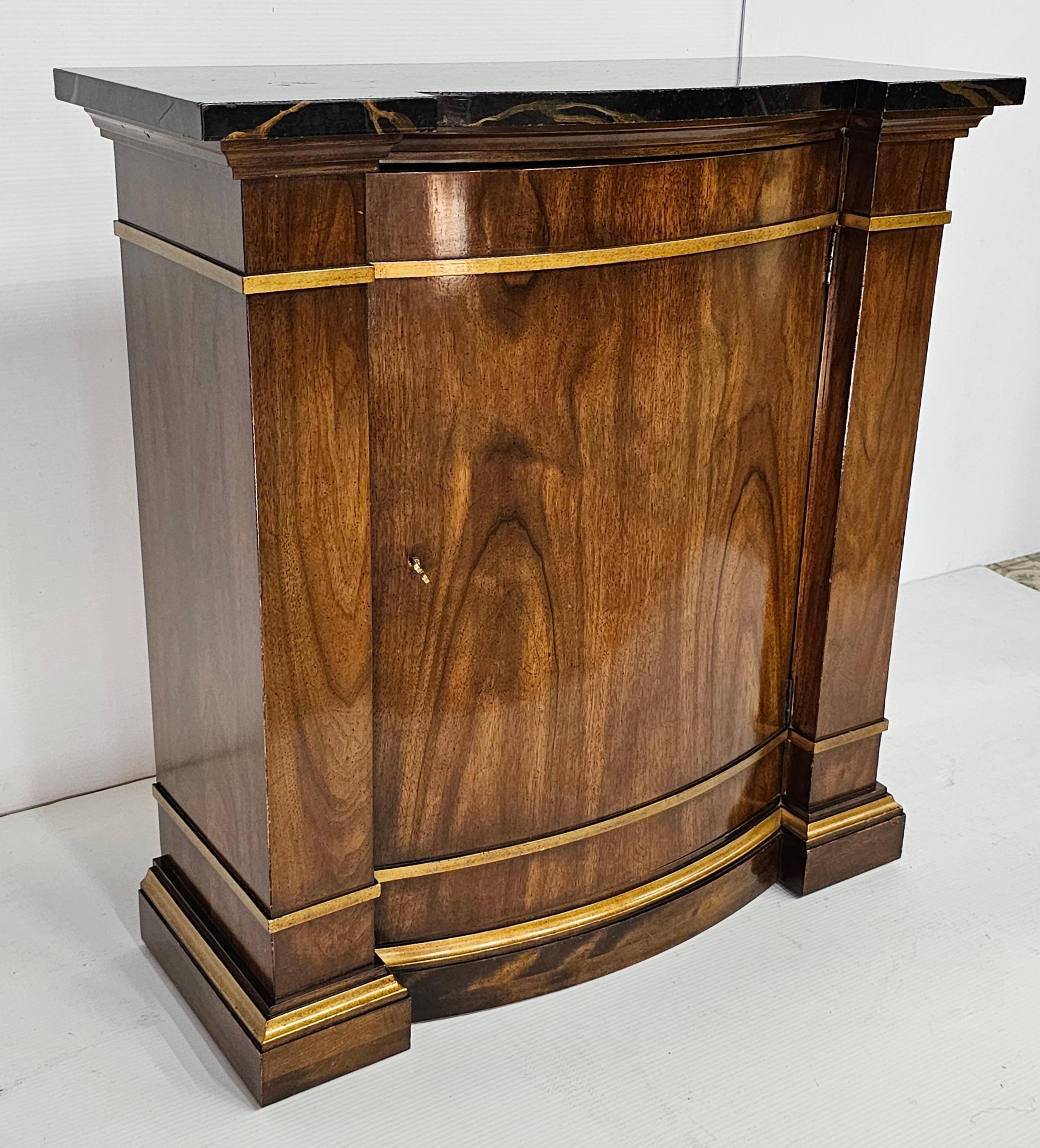 A late 20th Century Neoclassical Partial Gilt Decorated Fruitwood and Faux Marble Top Console Cabinet. One adjustable height shelf.
Measures 32.75