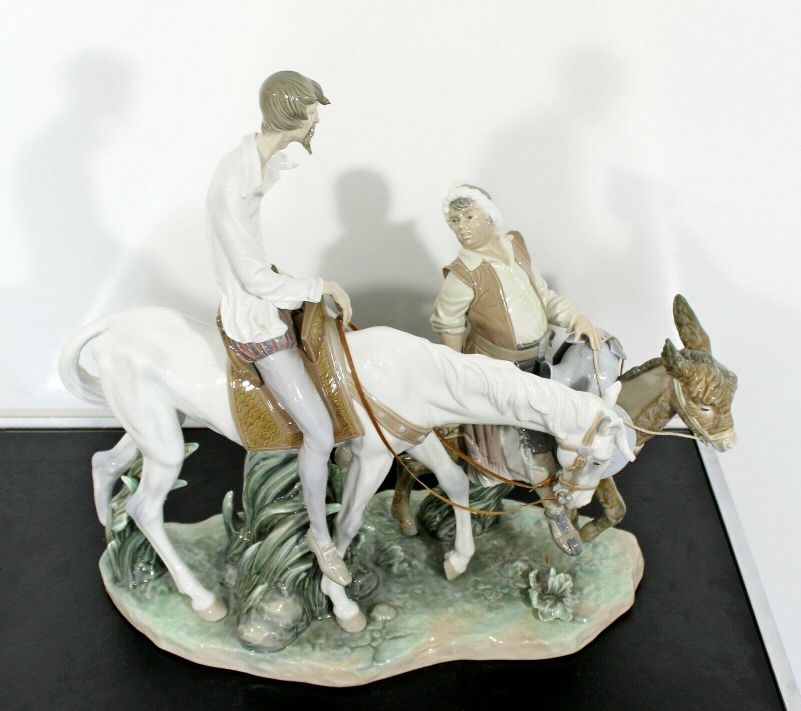 For your consideration is a gorgeous, porcelain table sculpture of Don Quixote and Sancho, signed Ruiz, stamped Lladro, handmade in Spain, circa 1970s. In excellent condition. The dimensions are 20