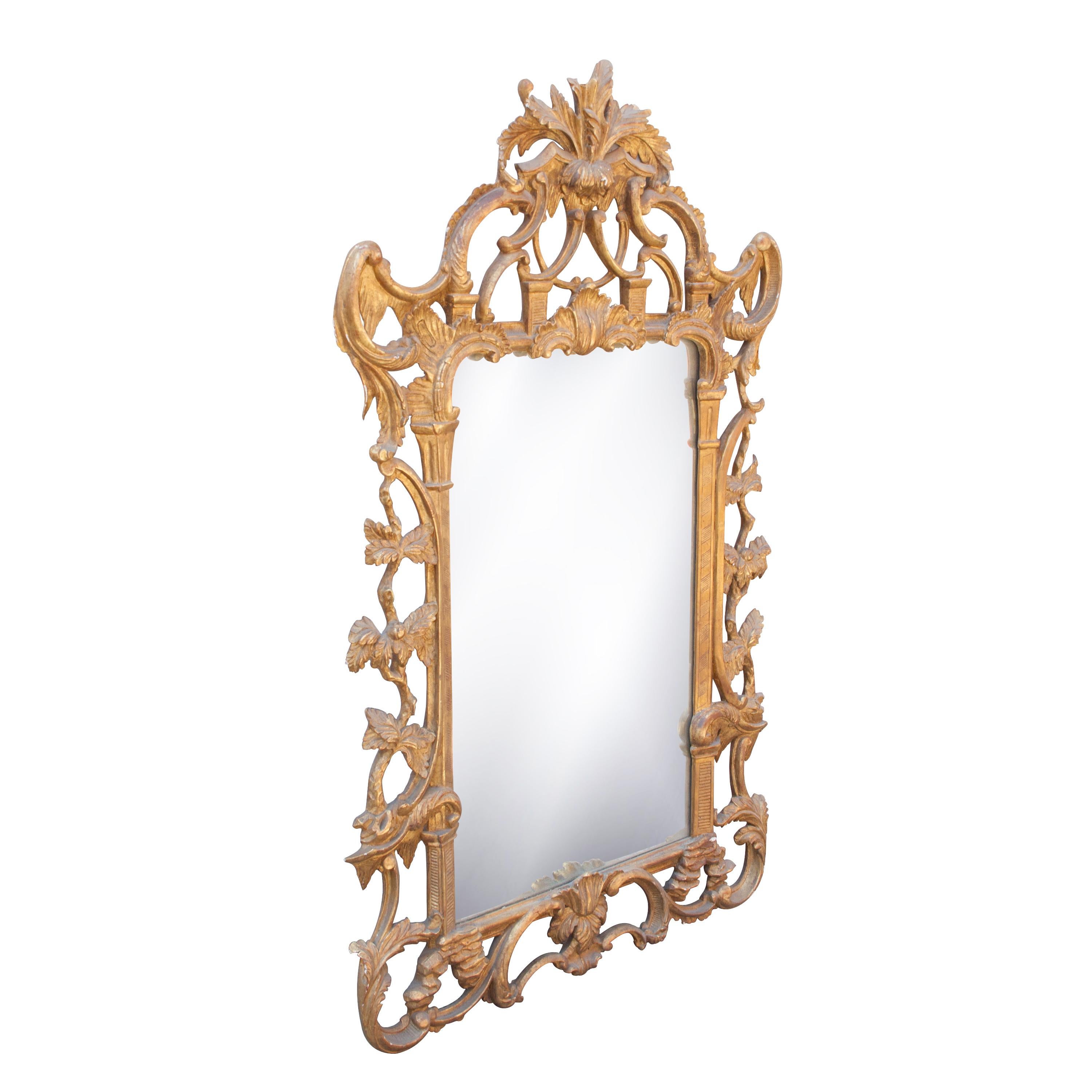 Neoclassical rectangular handcrafted mirror. Hand carved wooden structure with gold foil finished. Spain, 1970.