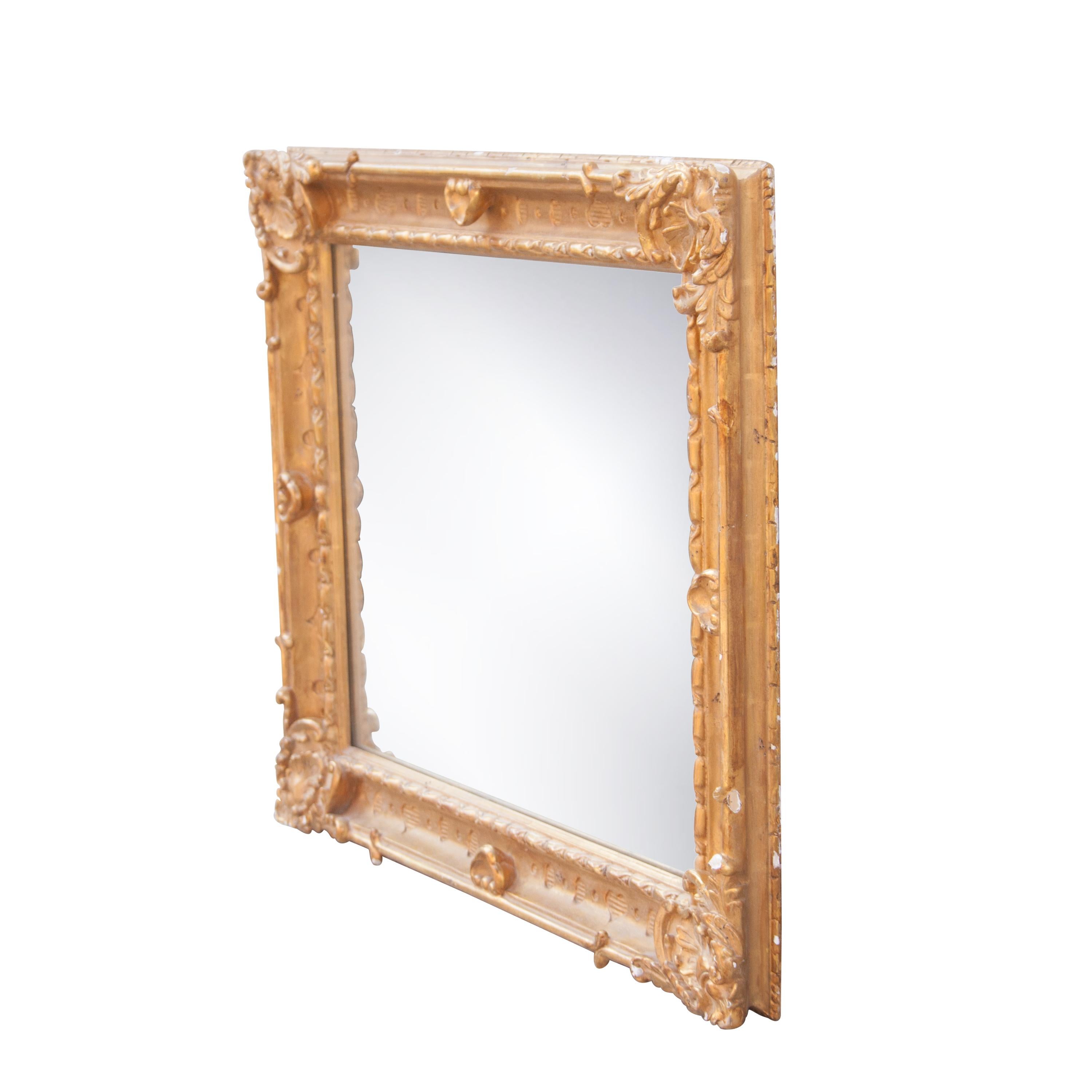 Neoclassical rectangular handcrafted mirror. Rectangular hand carved wooden structure with gold foil finished, Spain, 1970.