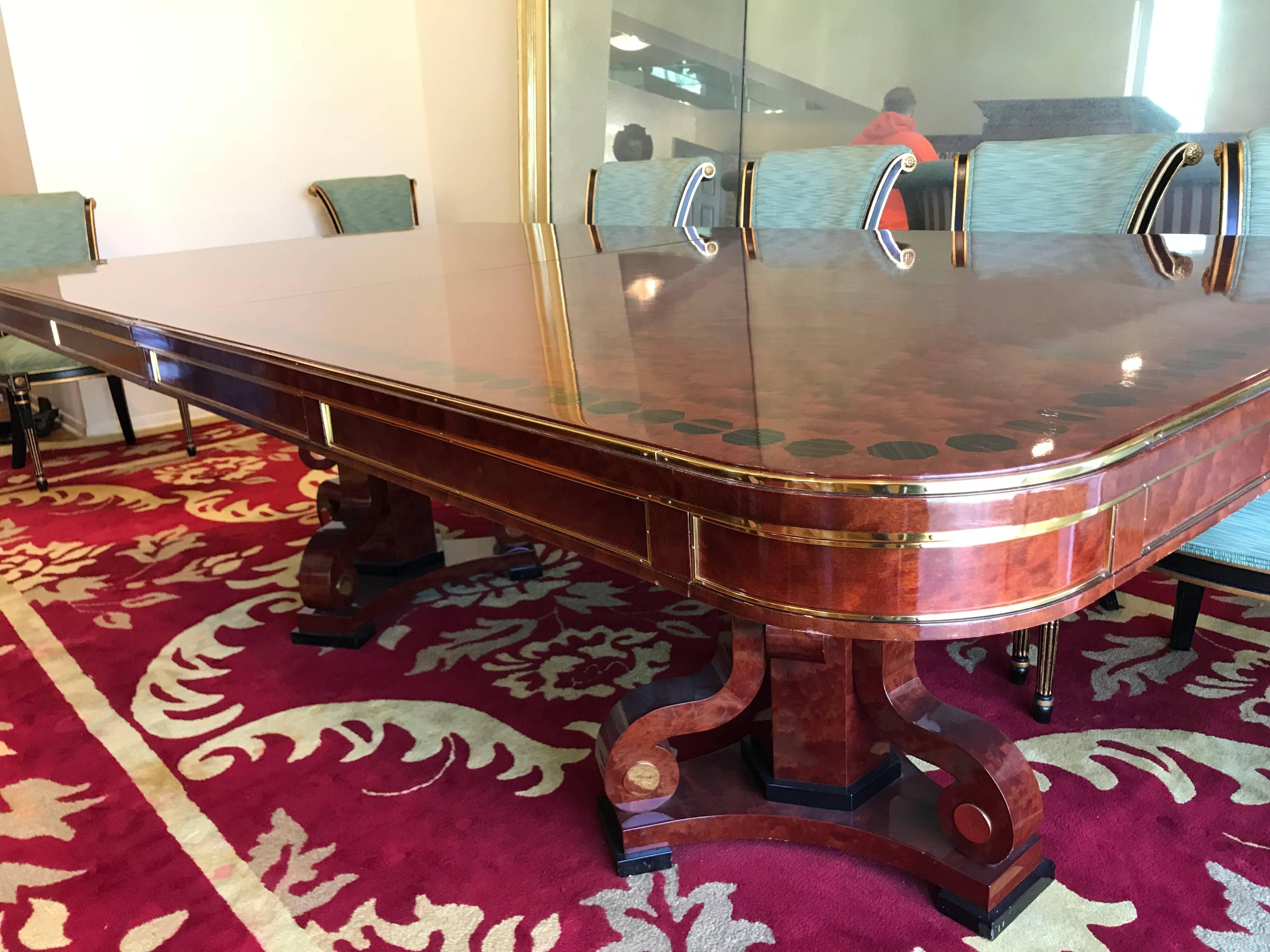 A wonderful neoclassical / Regency double pedestal dining room table with marquetry and inlaid and bronze ormolu mounts in the manner of Jansen.
Accompanied by a leaf that measures 24