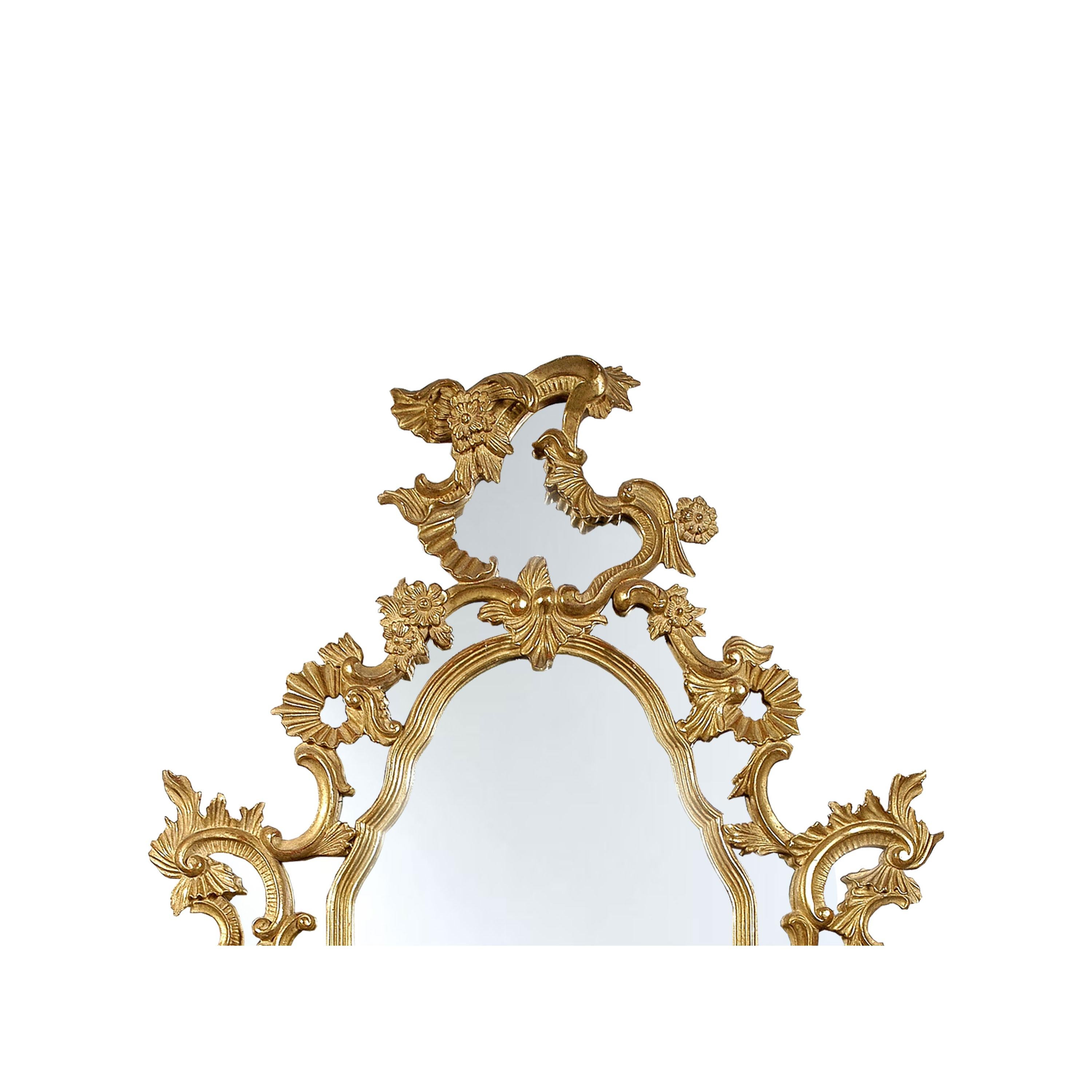 Neoclassical Regency style handcrafted mirror. Rectangular hand carved wooden structure with gold foiled finish. Spain, 1970.