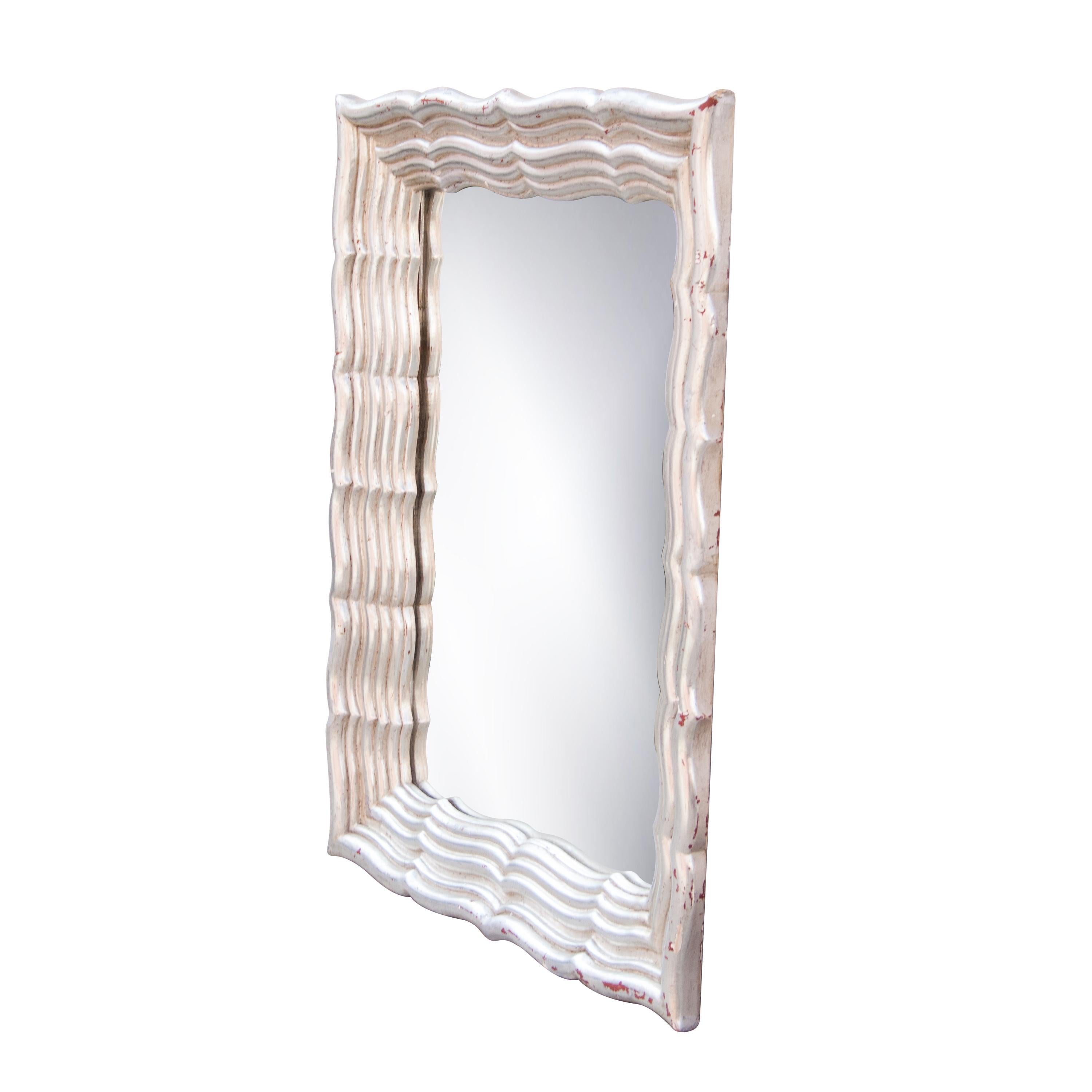 Neoclassical Regency style handcrafted mirror. Rectangular hand carved wooden structure with silver foiled finish, Spain, 1970.