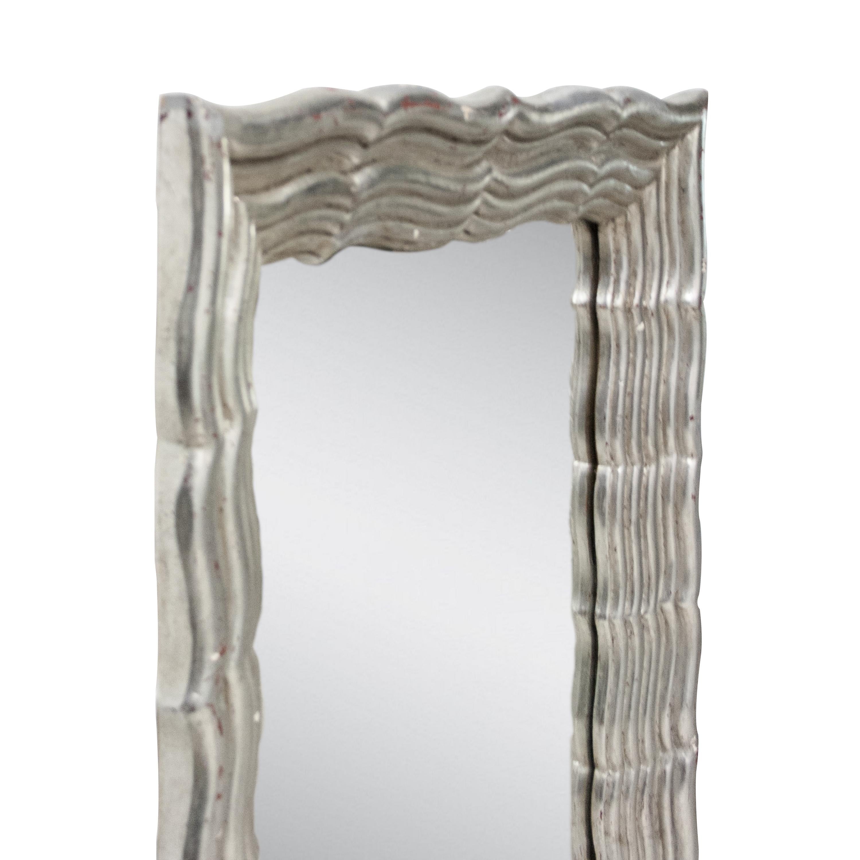 Neoclassical Regency style handcrafted mirror. Rectangular hand carved wooden structure with silver foiled finish, Spain, 1970.