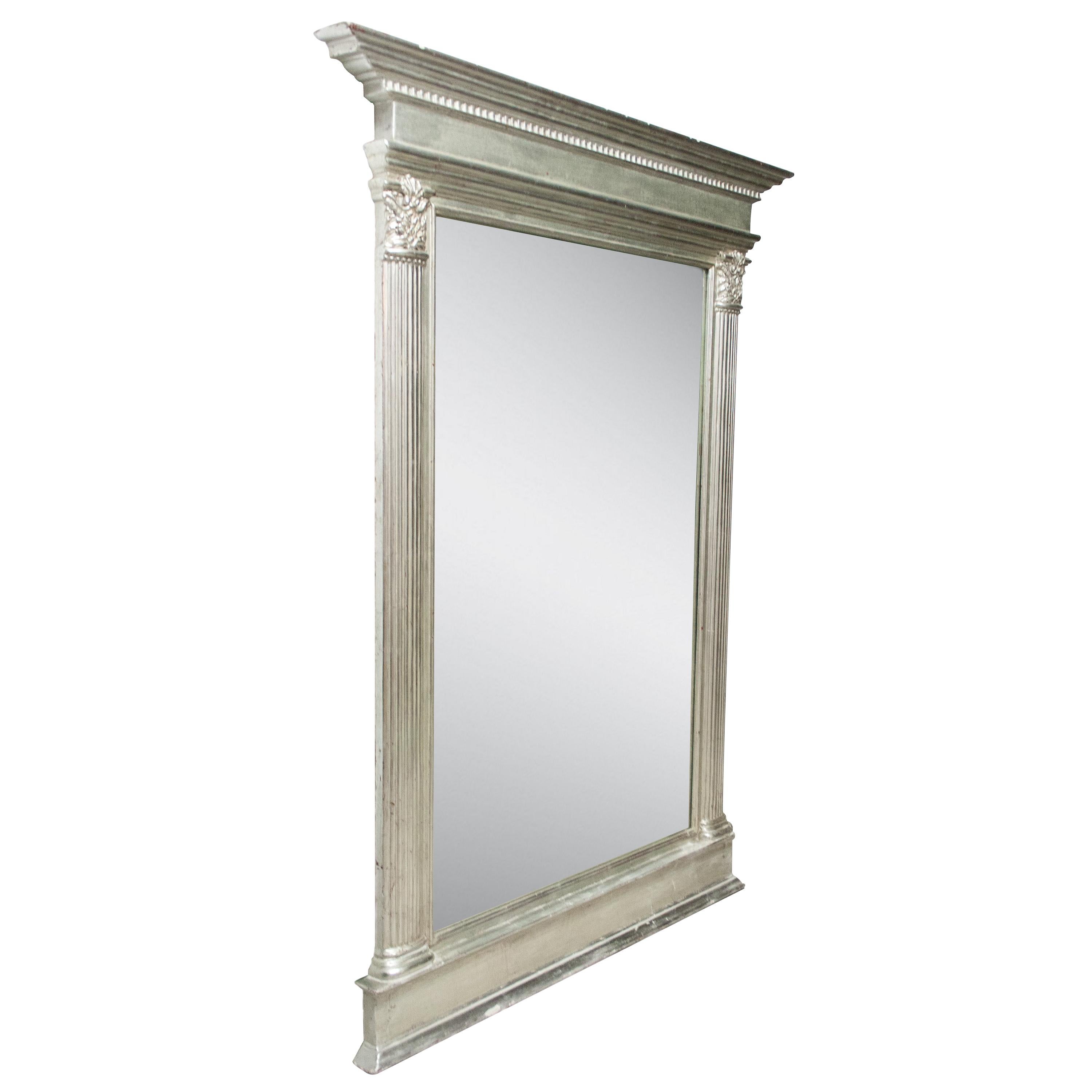 Neoclassical Regency style handcrafted mirror. Rectangular hand carved wooden structure with silver foiled finish. Spain, 1970.