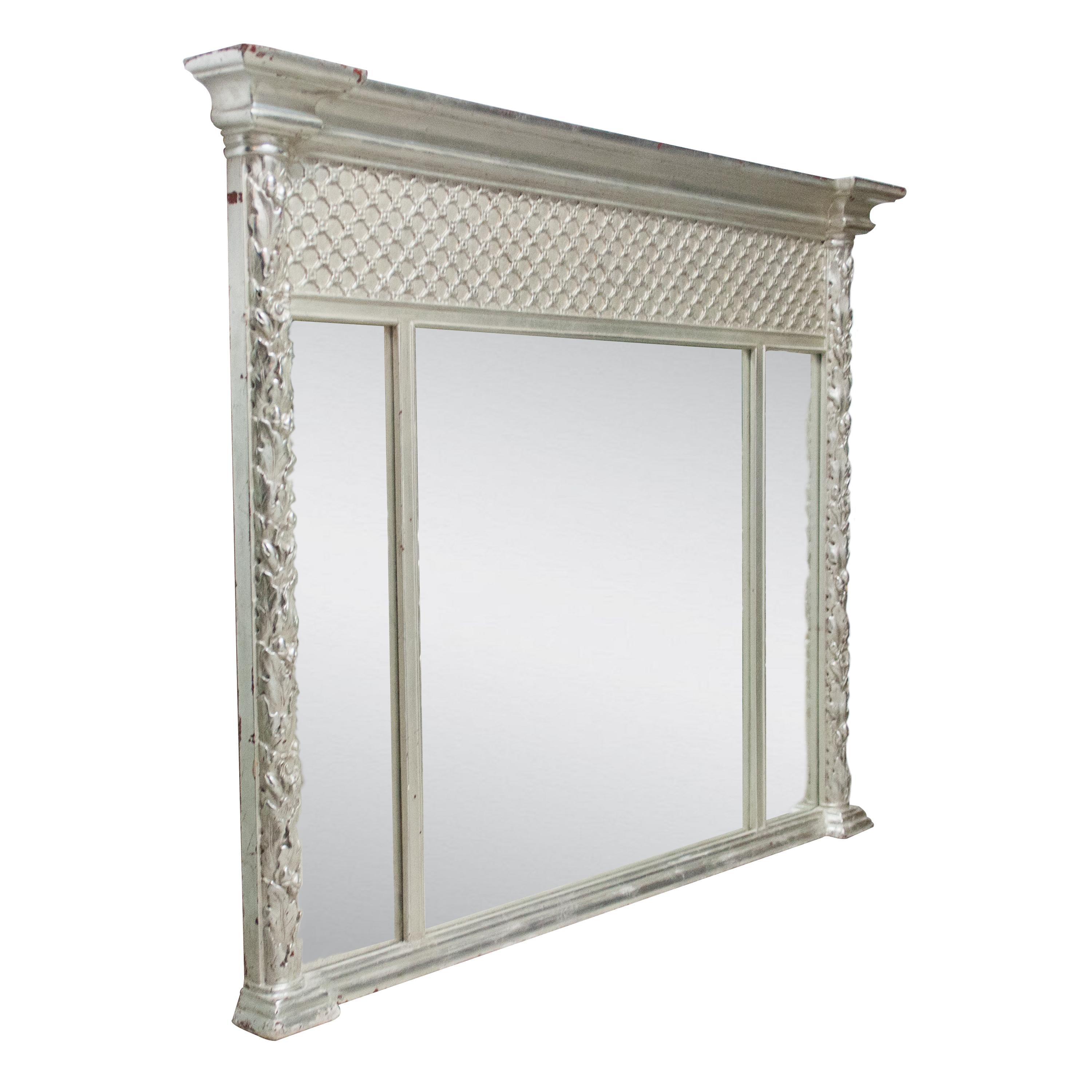 Neoclassical Regency style handcrafted mirror. Rectangular triptych mirror, hand carved wooden structure with silver foiled finish. Spain, 1970.
