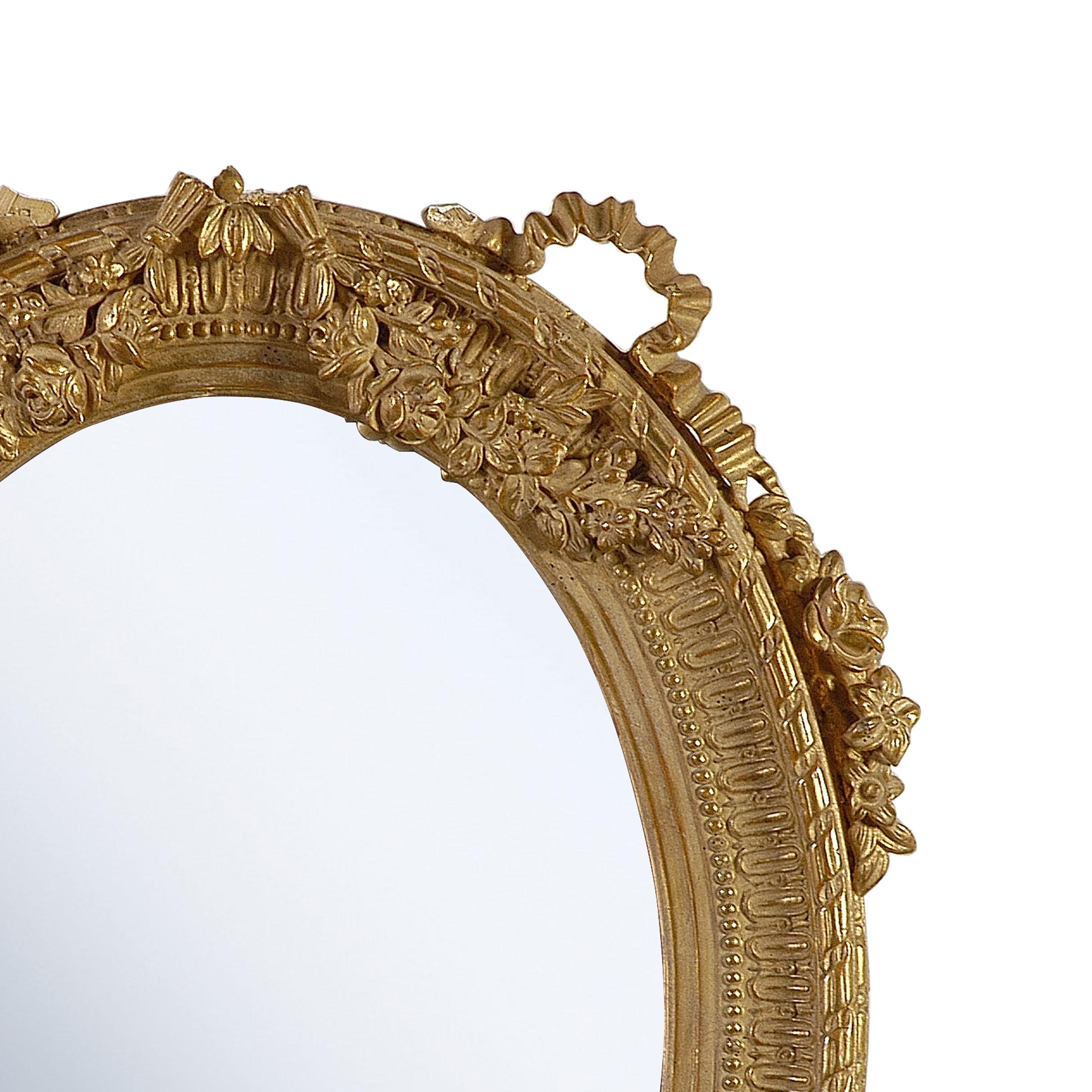 Neoclassical Regency style handcrafted mirror. Round, hand carved wooden structure with gold foil finished, Spain, 1970.