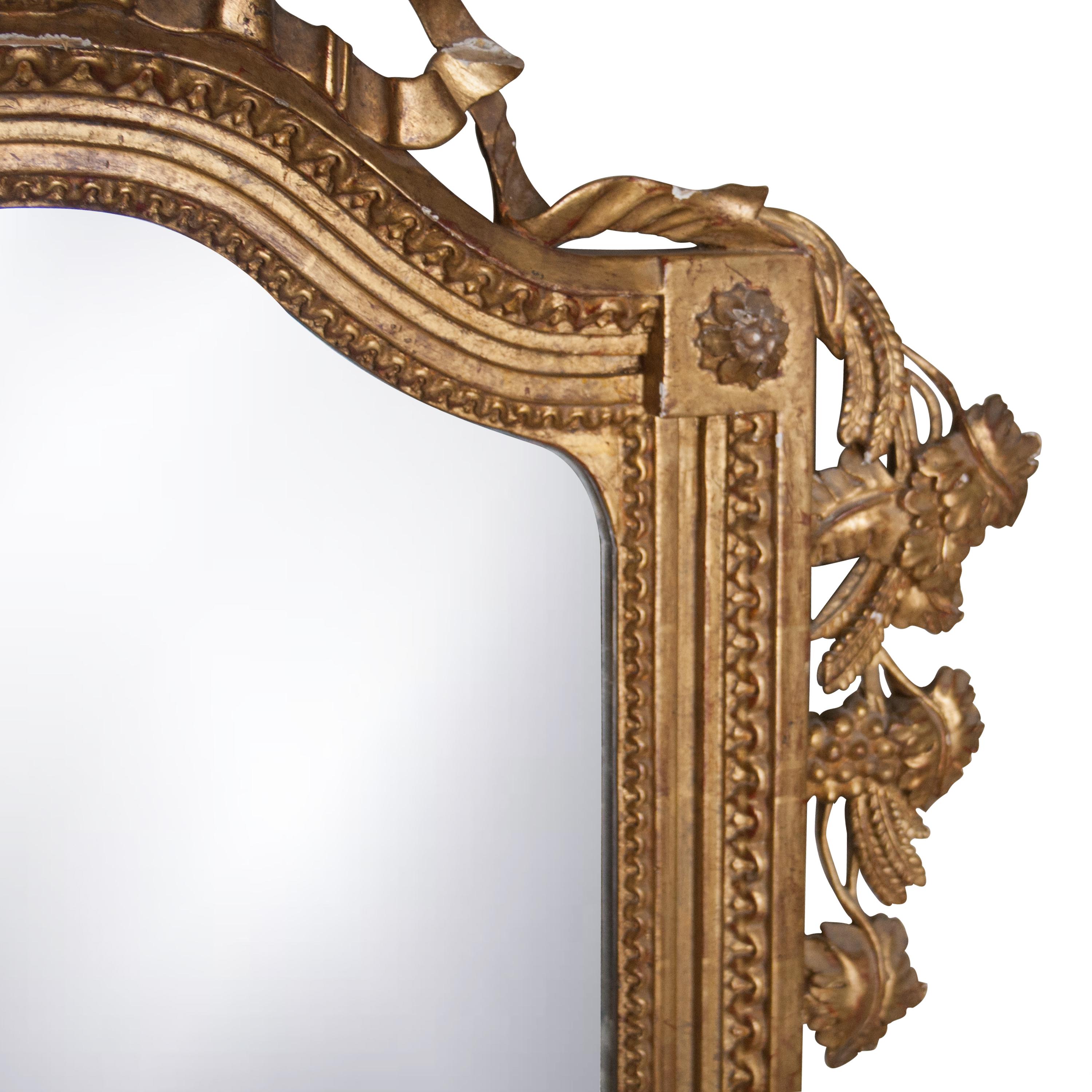 Neoclassical Regency style handcrafted mirror. Rectangular and carved wooden structure with gold foil finished, Spain, 1970.