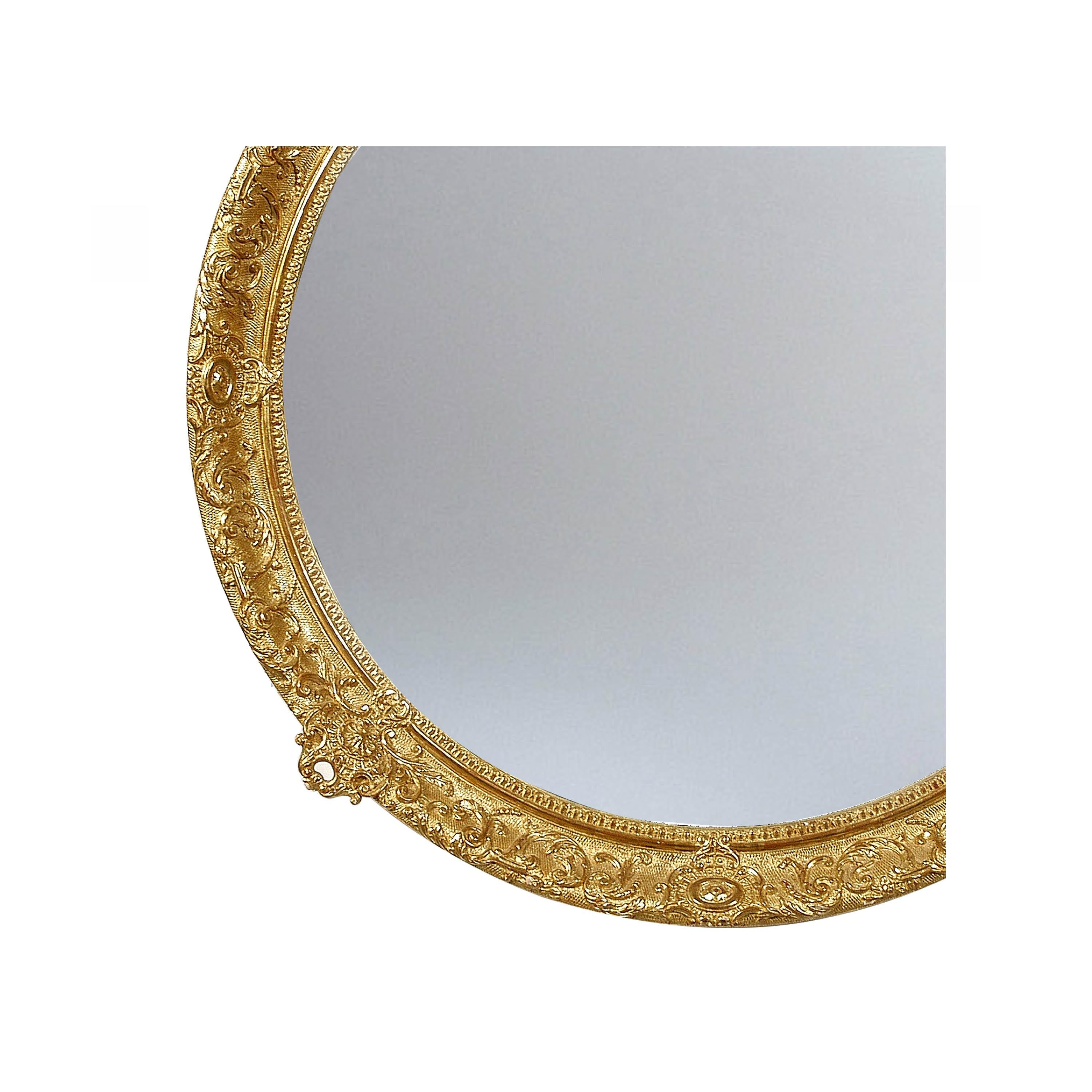 Neoclassical Regency style handcrafted mirror. Round hand carved wooden structure with gold finished. Spain, 1970.