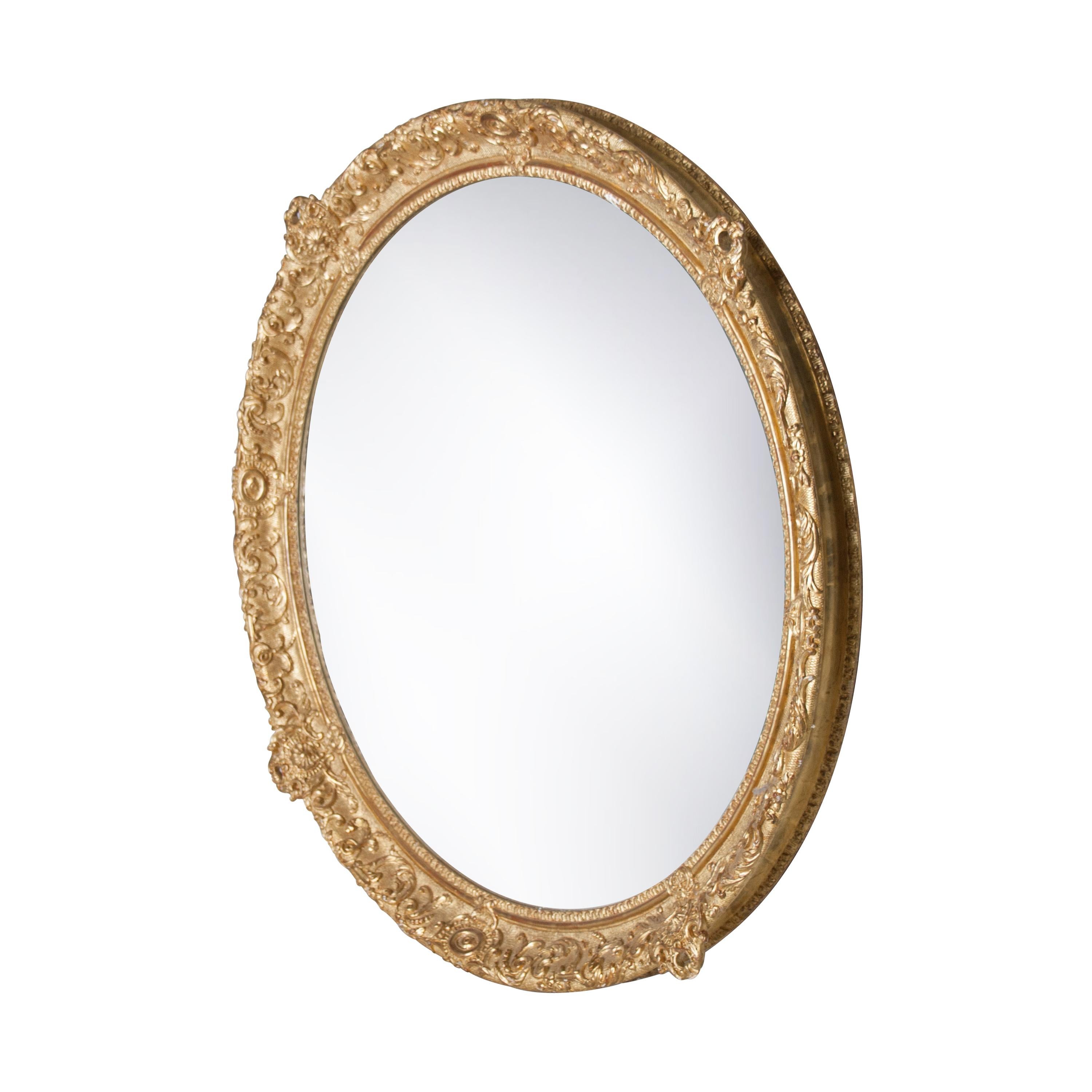 Neoclassical Regency style handcrafted mirror. Round hand carved wooden structure with gold finished. Spain, 1970.