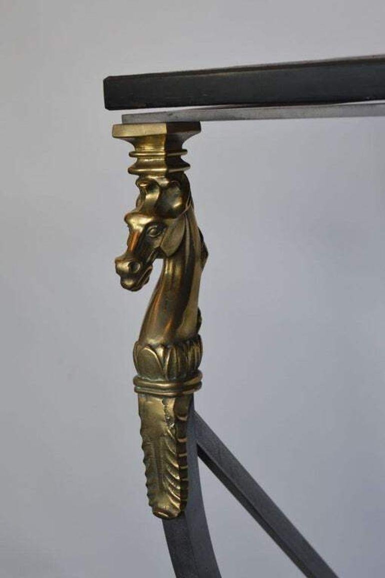 A striking Italian console table dating from the 1940s–1950s, masterfully crafted in bronze and steel. This elegant piece features finely detailed horse head finials at the top of each leg and hoof feet at the base, exemplifying the artisan’s