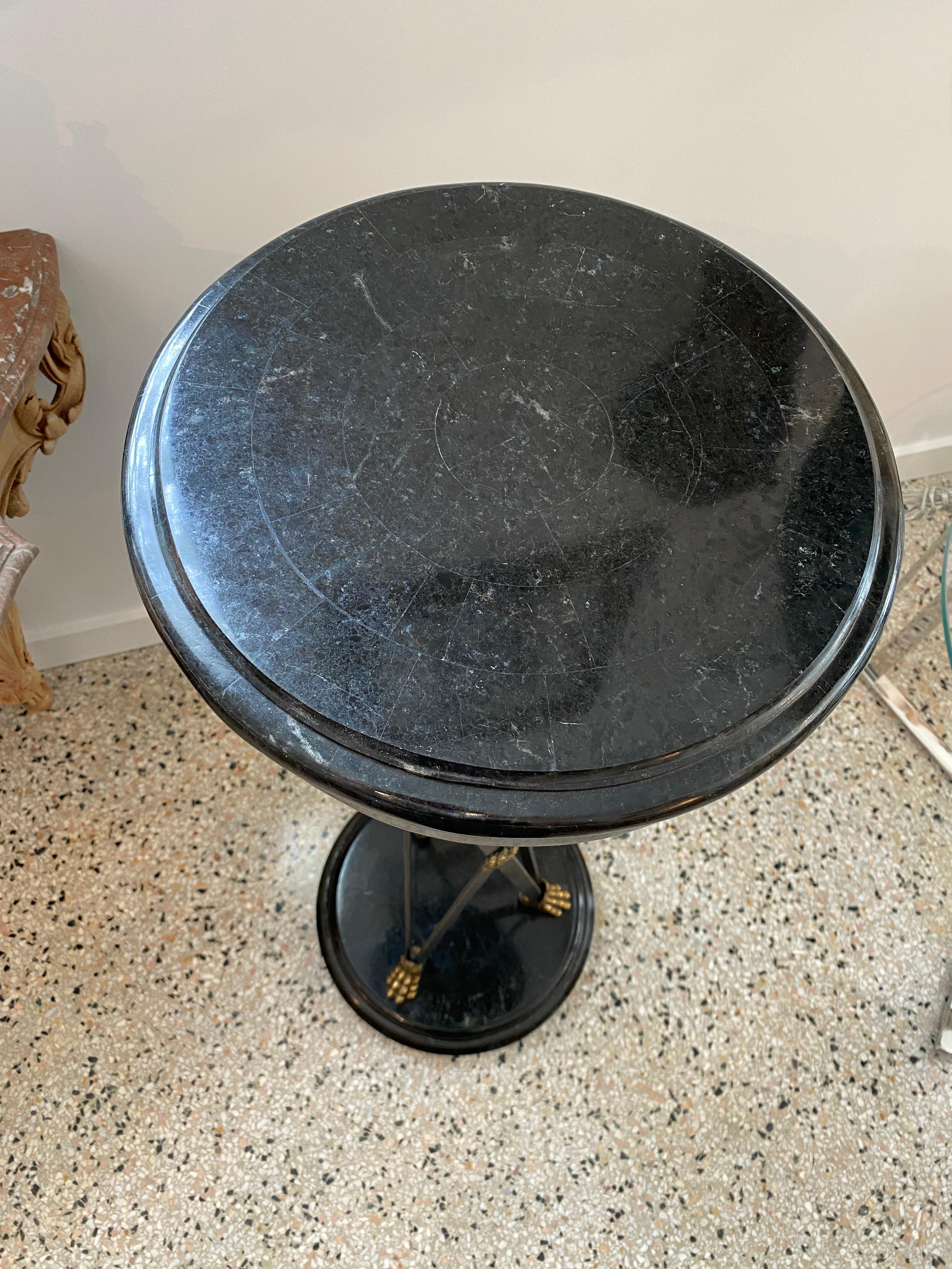 This stylish neo-classical revival style pedestal dates to the 1980s-1990s and is by Maitland Smith. 

Note: The dark green marble is tessellated.

Note: Dimensions of the top are 13.50