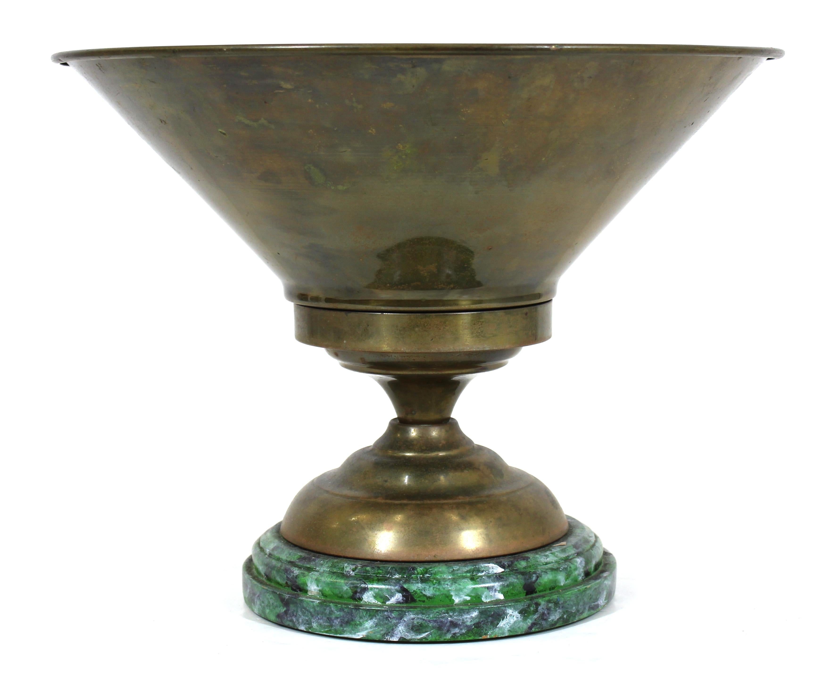 Neoclassical Revival style brass jardinière planter on faux-marble painted round wood base. Measures: 12.5
