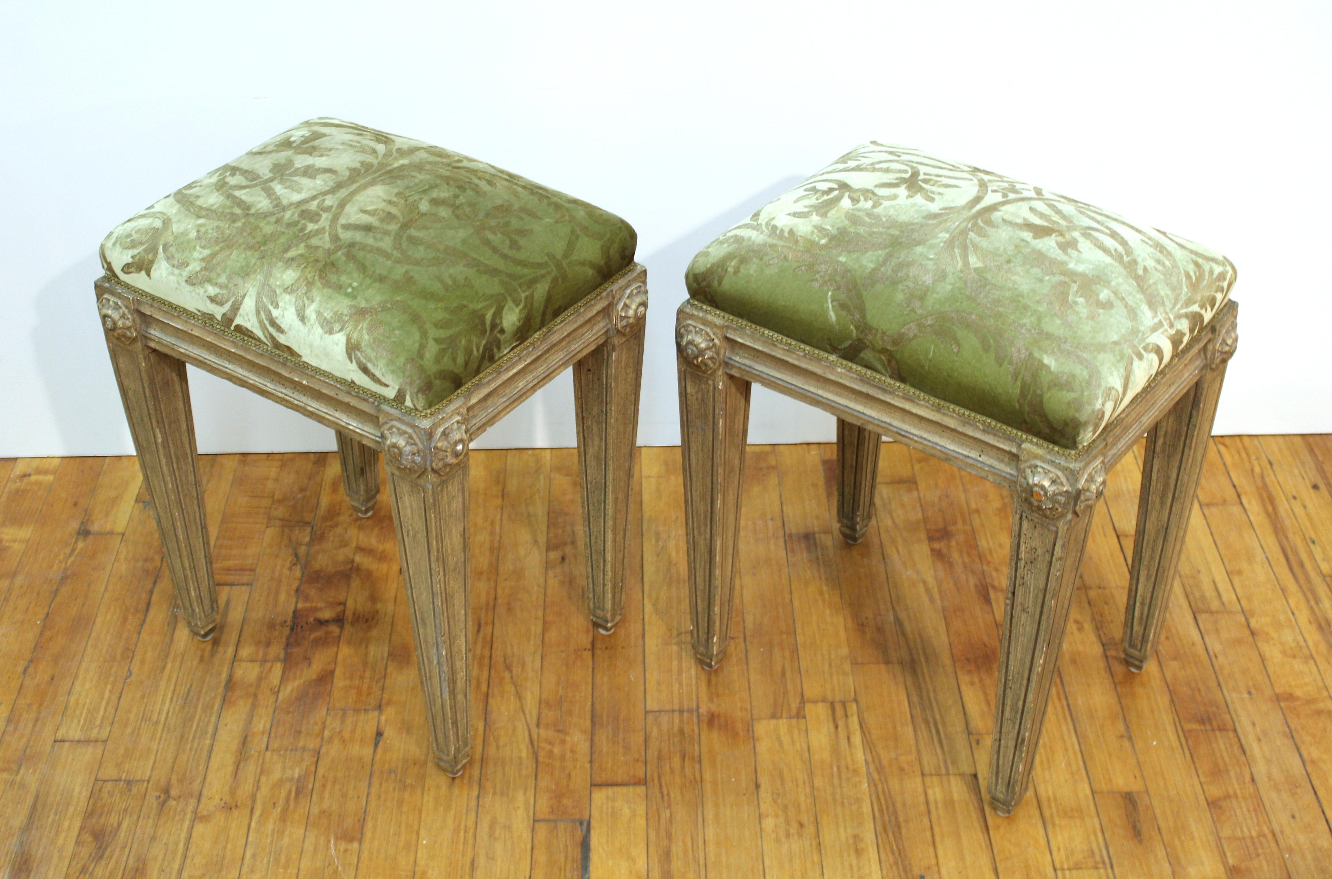 Pair of Neoclassical Revival style carved wood benches with upholstery. In great vintage condition with age-appropriate wear and use.